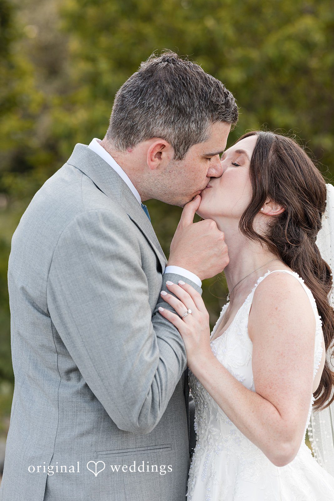 Kerri + David Bride and groom sharing a kiss at Oceanview of Nahant