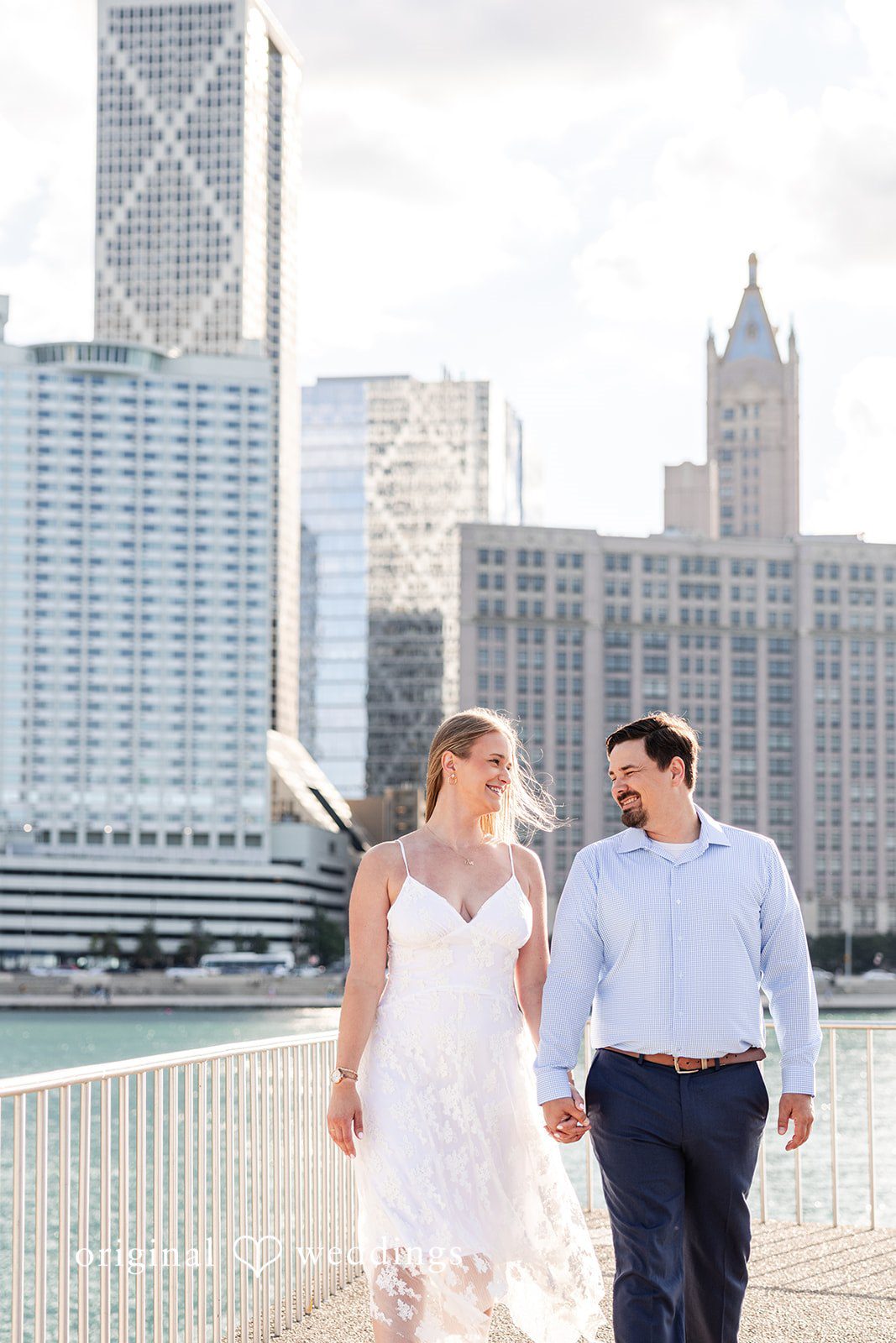 The couple takes a walk through the dock
