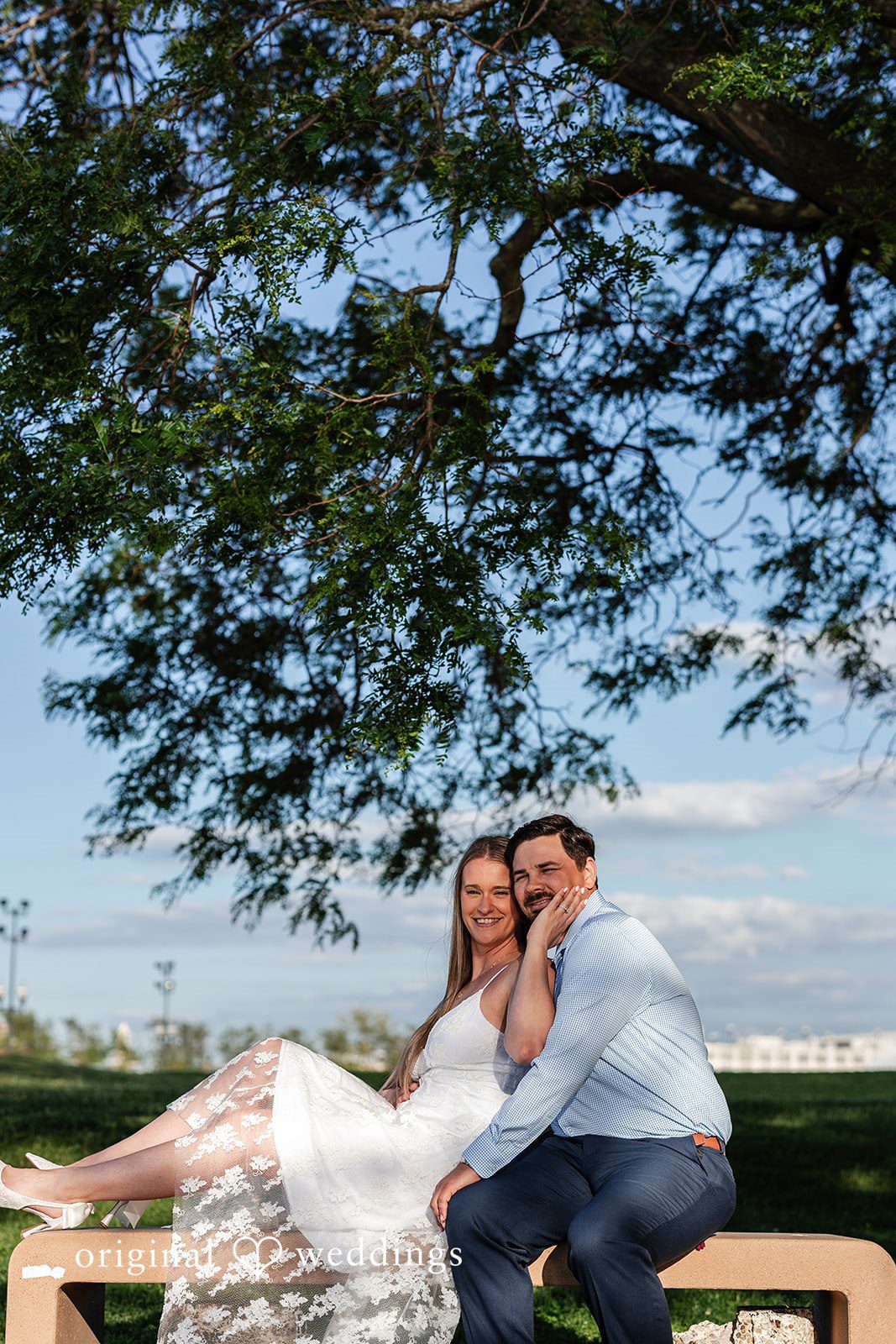 Our Chicago engagement photographers captured a stunning portrait of the couple by the greenery at the park