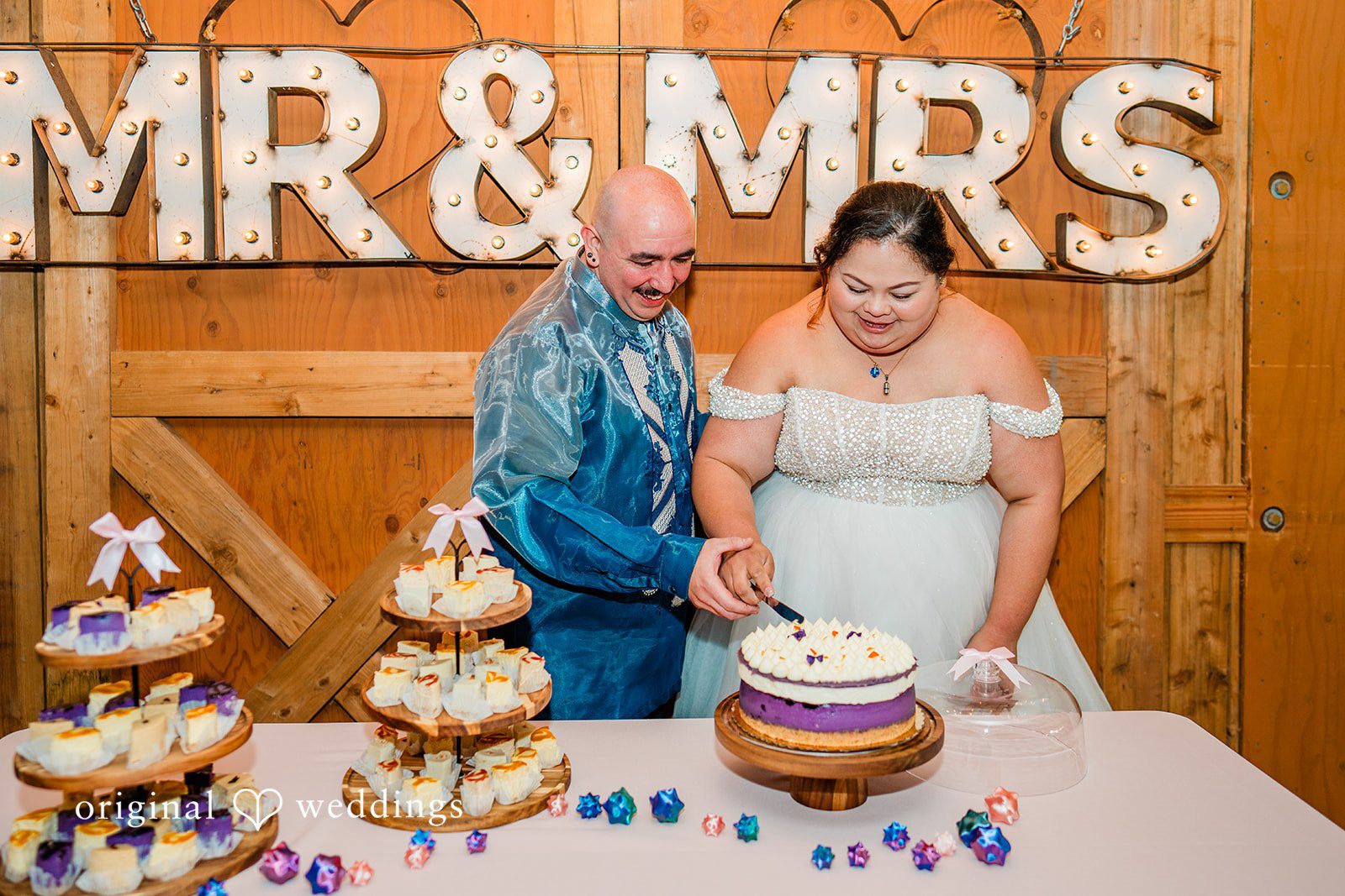 Tiffany Hazel + Ryan The couple cuts their wedding cake