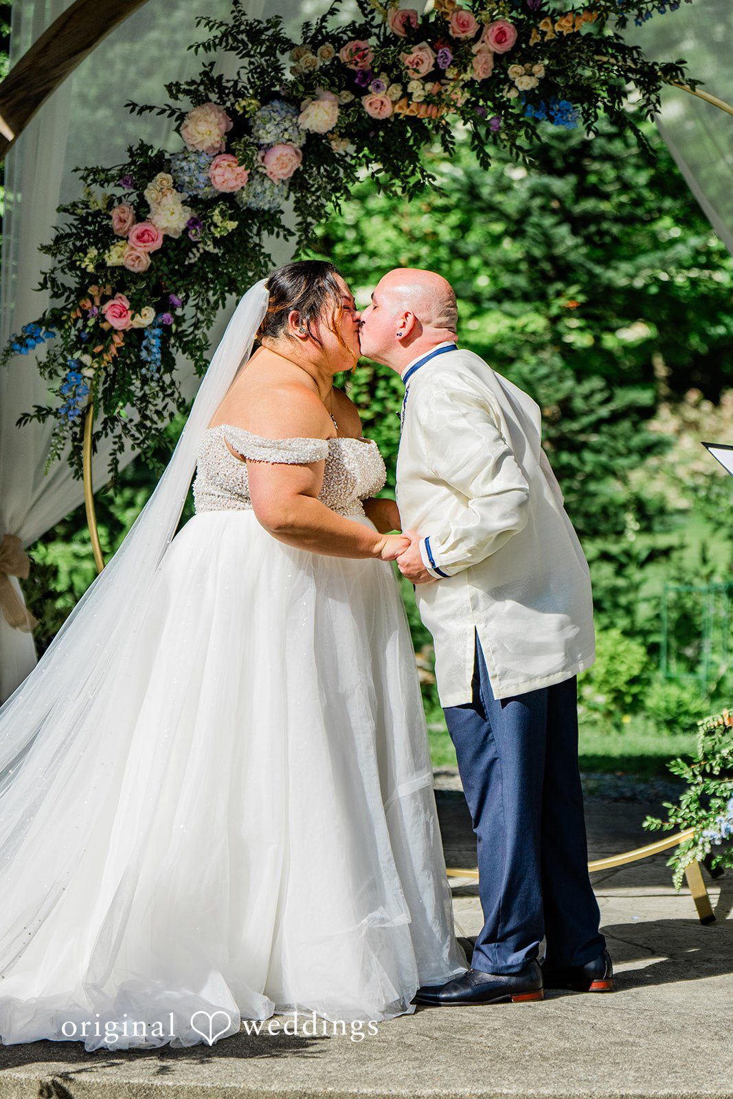 Tiffany Hazel + Ryan The couple takes a kiss to seal their vows
