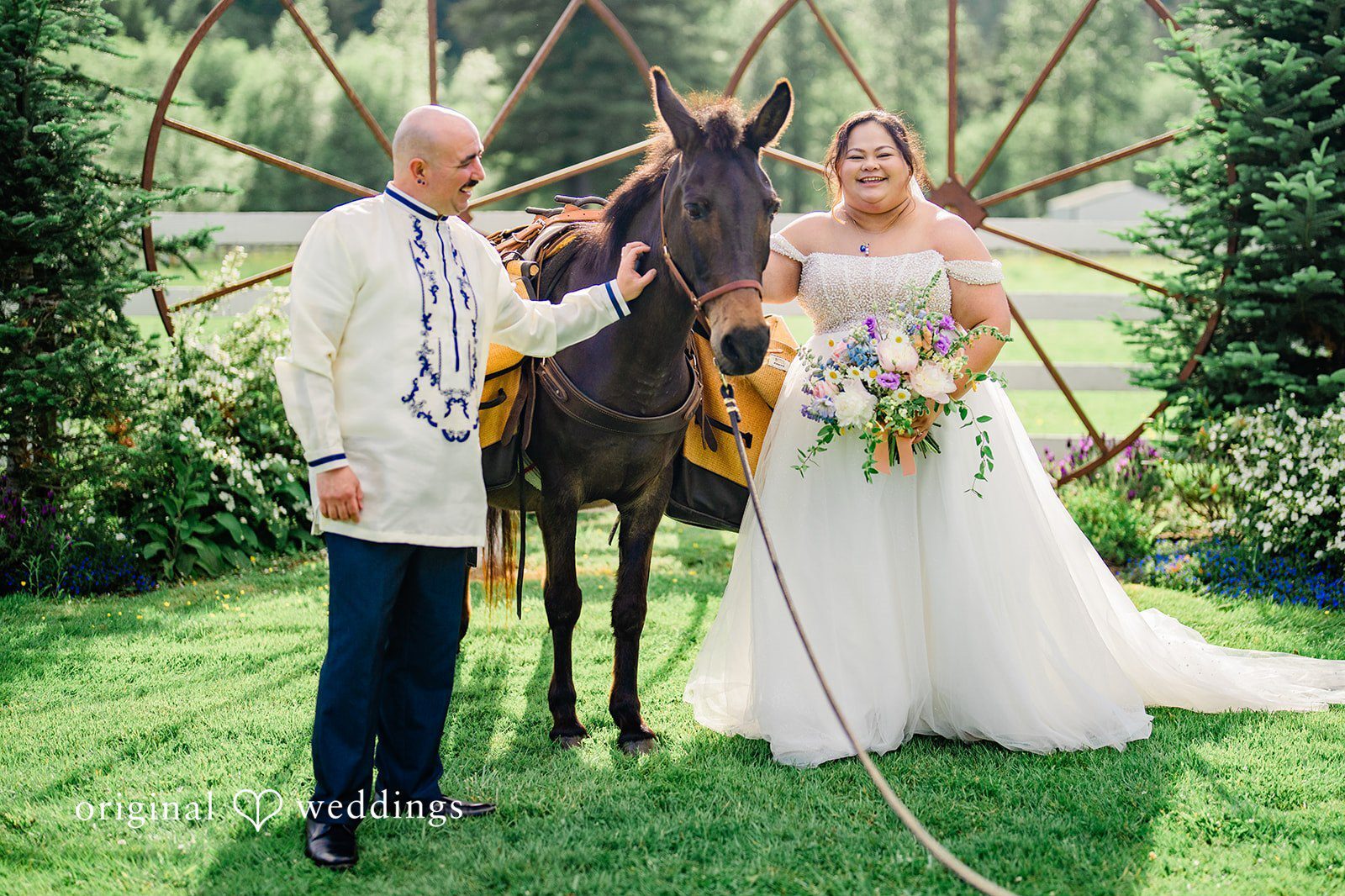 Our Seattle wedding photographers at Original Weddings captured the couple beside their huge horse at the Rein Fire Ranch