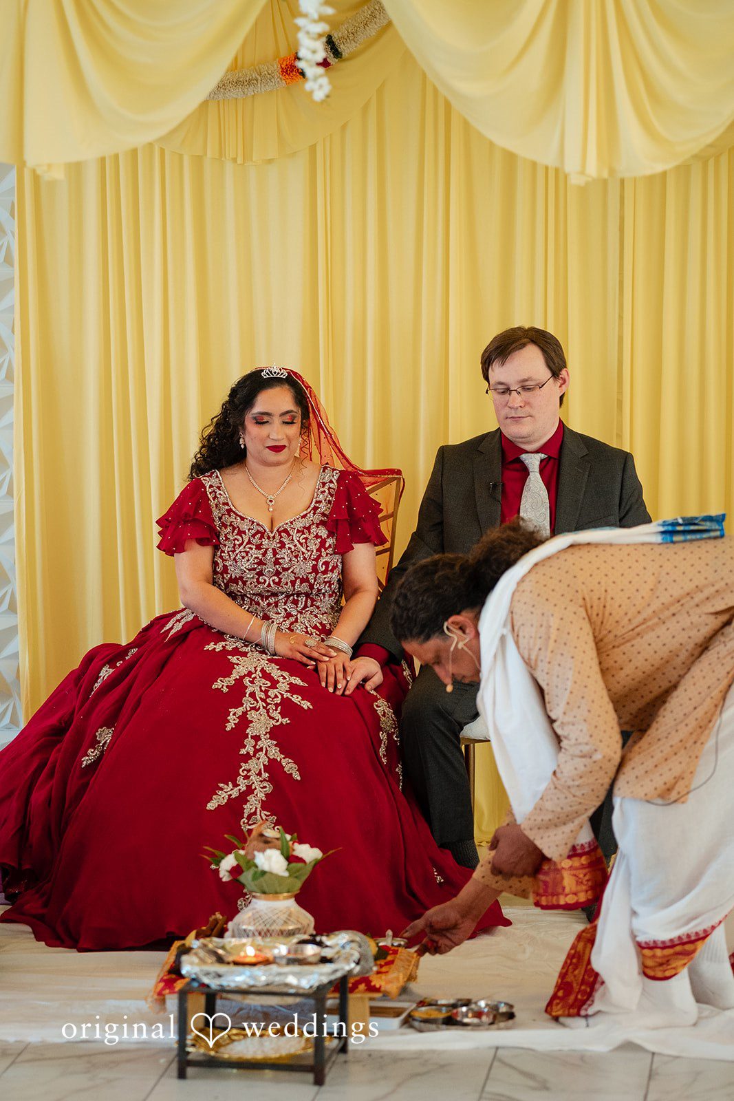 Anthony + Simi A traditional wedding ceremony where a ritual is performed on the floor.