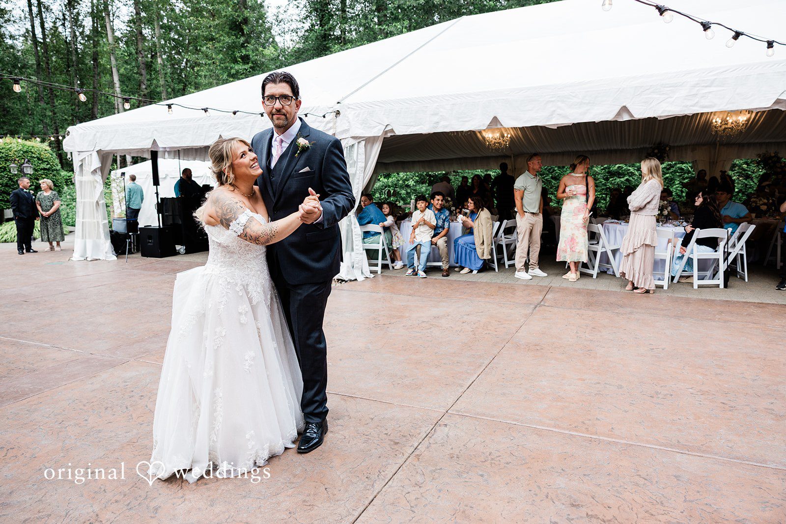 AlyssaMay + Benjamin Bride sharing a dance with someone