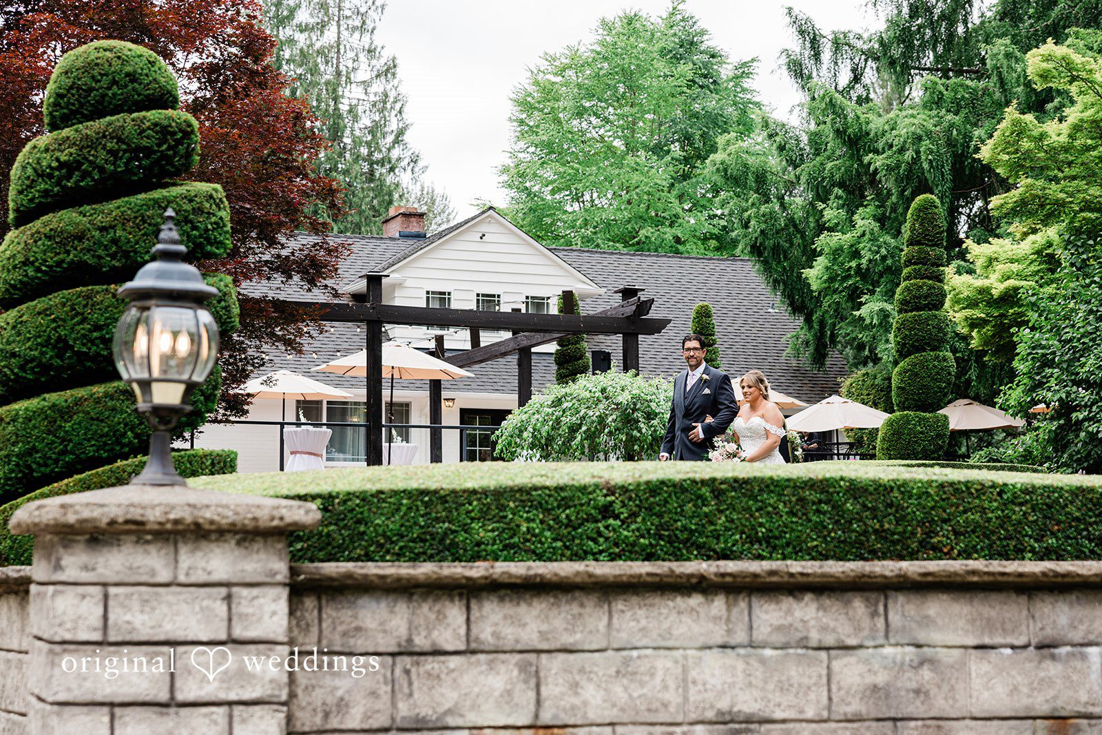 AlyssaMay + Benjamin Bride walking with someone at Rock Creek Gardens