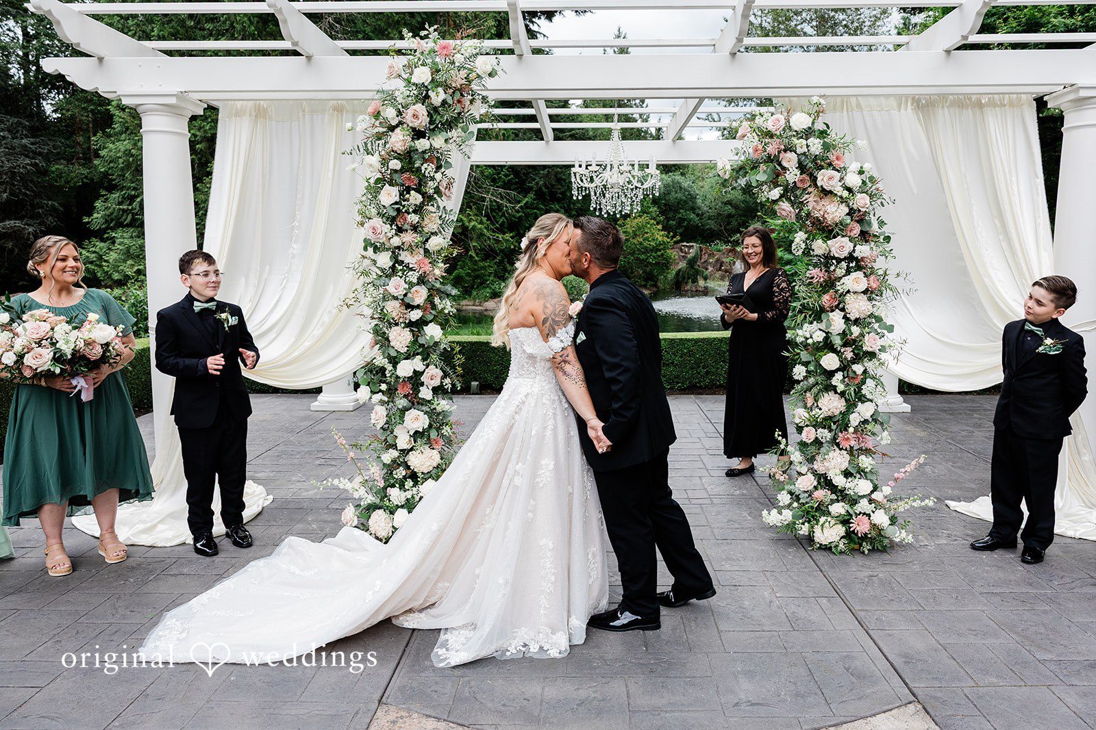 AlyssaMay + Benjamin Romantic first kiss moment of bride and groom at Rock Creek Gardens