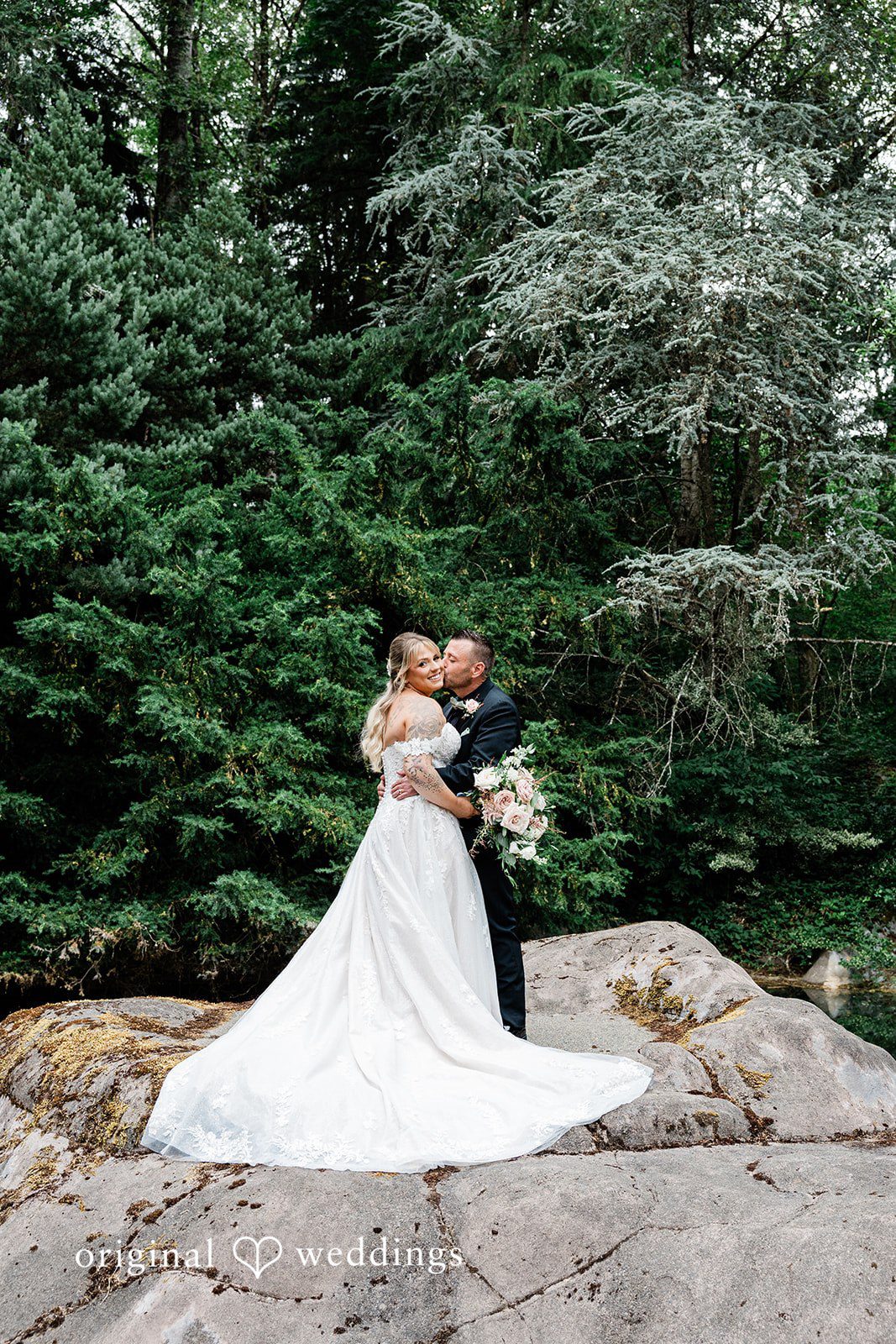 AlyssaMay + Benjamin A candid hug and kiss moment of bride and groom at Rock Creek Gardens