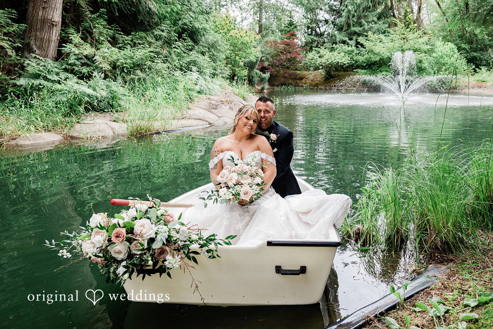 AlyssaMay + Benjamin Lovely picture of bride and groom in a boat