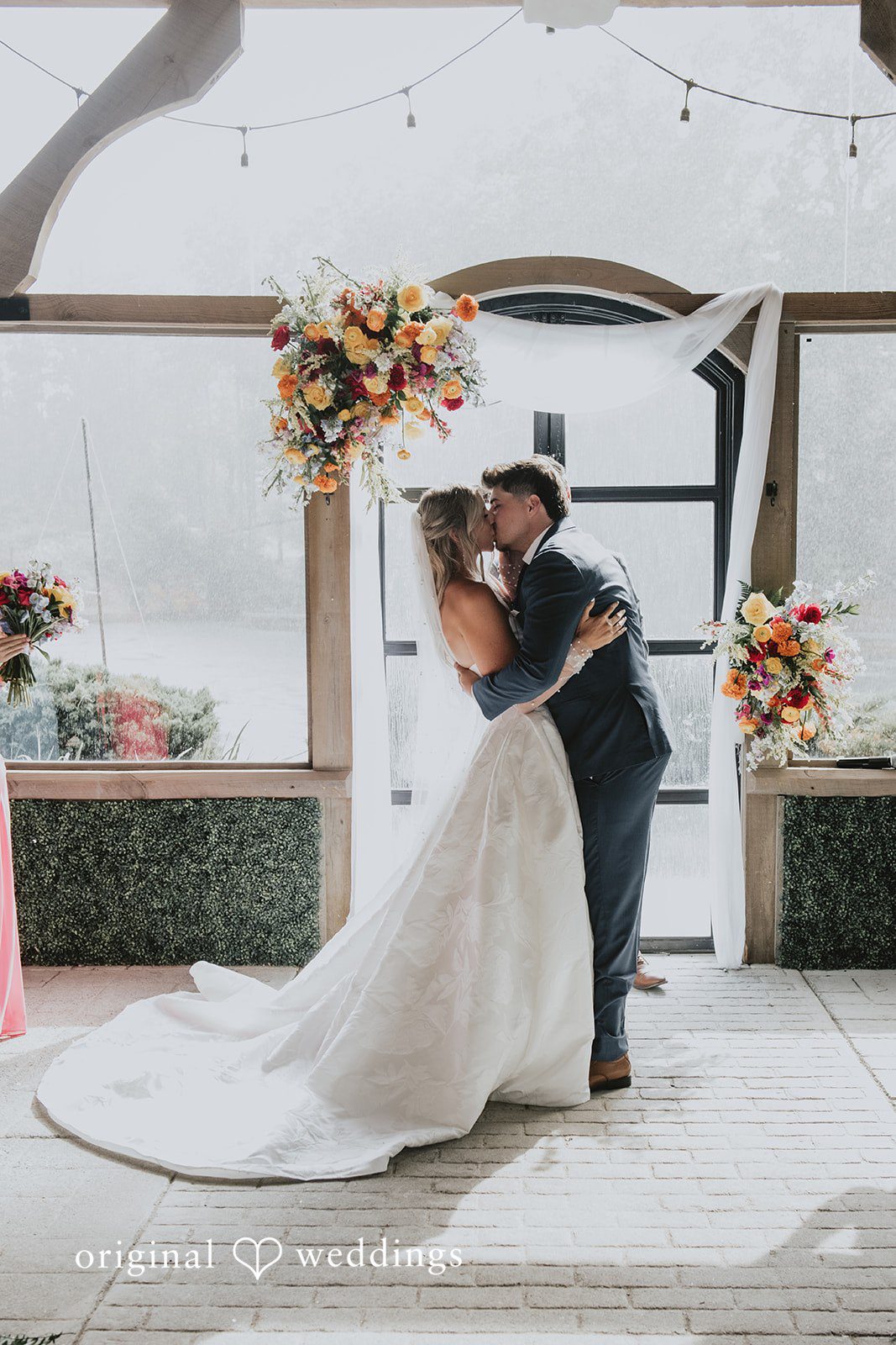 Julia + Kaleb Bride and groom sharing their first kiss after the vows