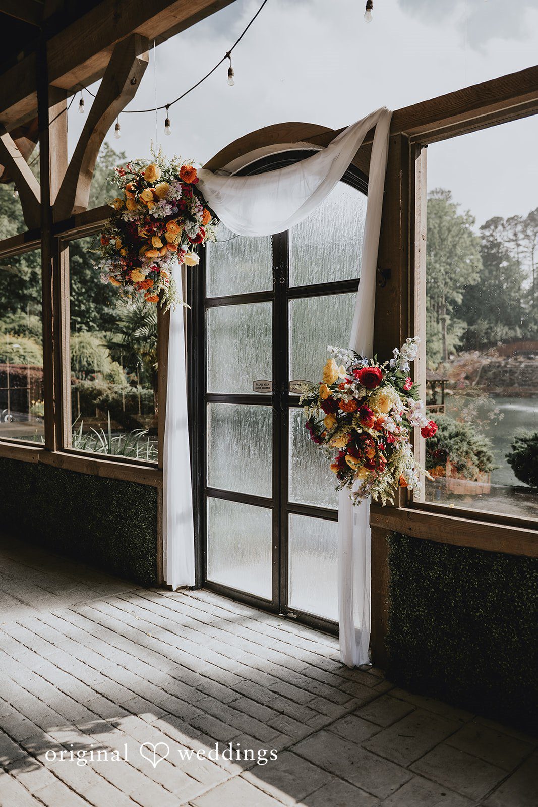 Julia + Kaleb Indoor venue view with a beautiful lake backdrop