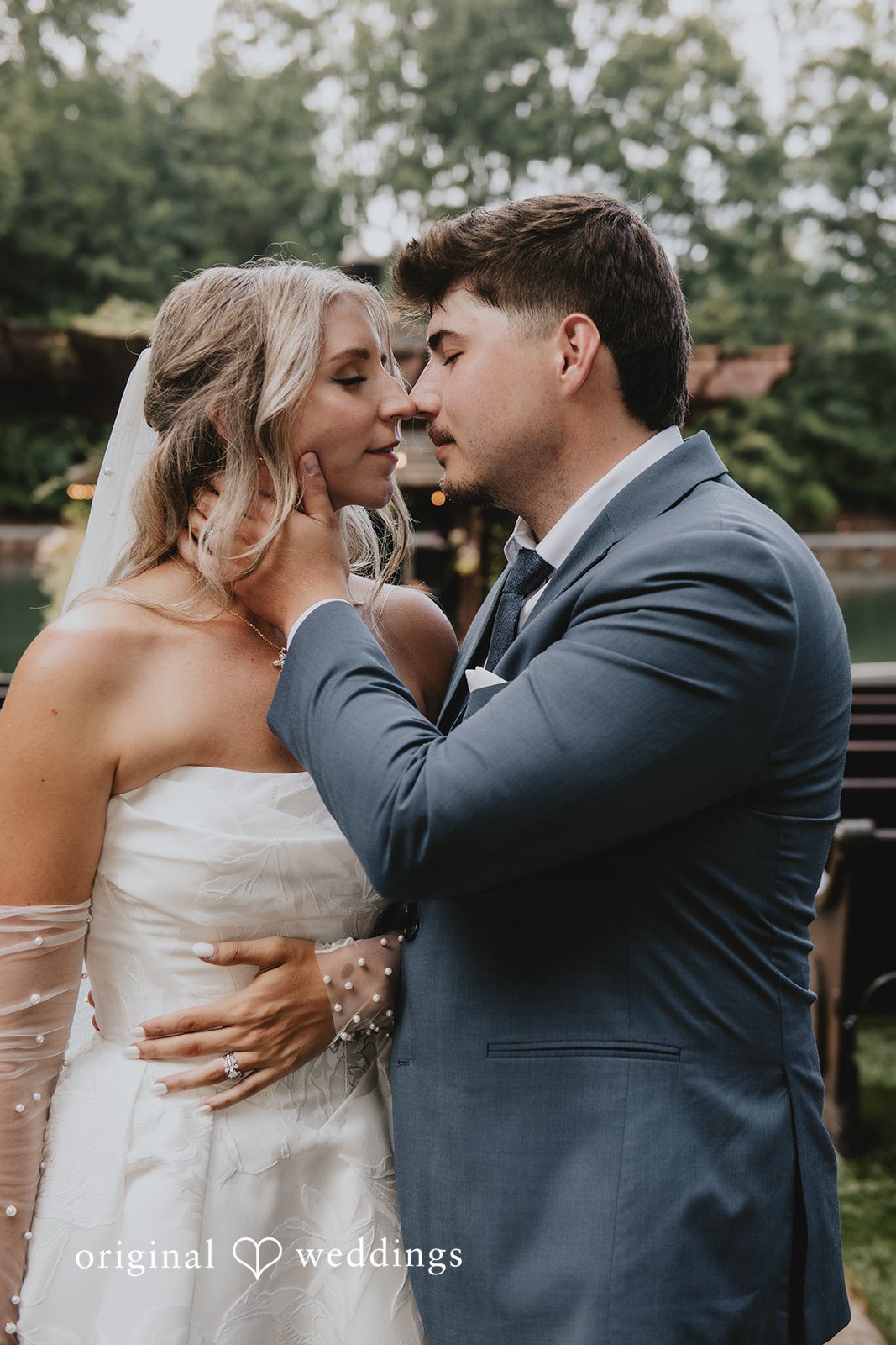 Julia + Kaleb Groom kissing the bride during wedding portraits