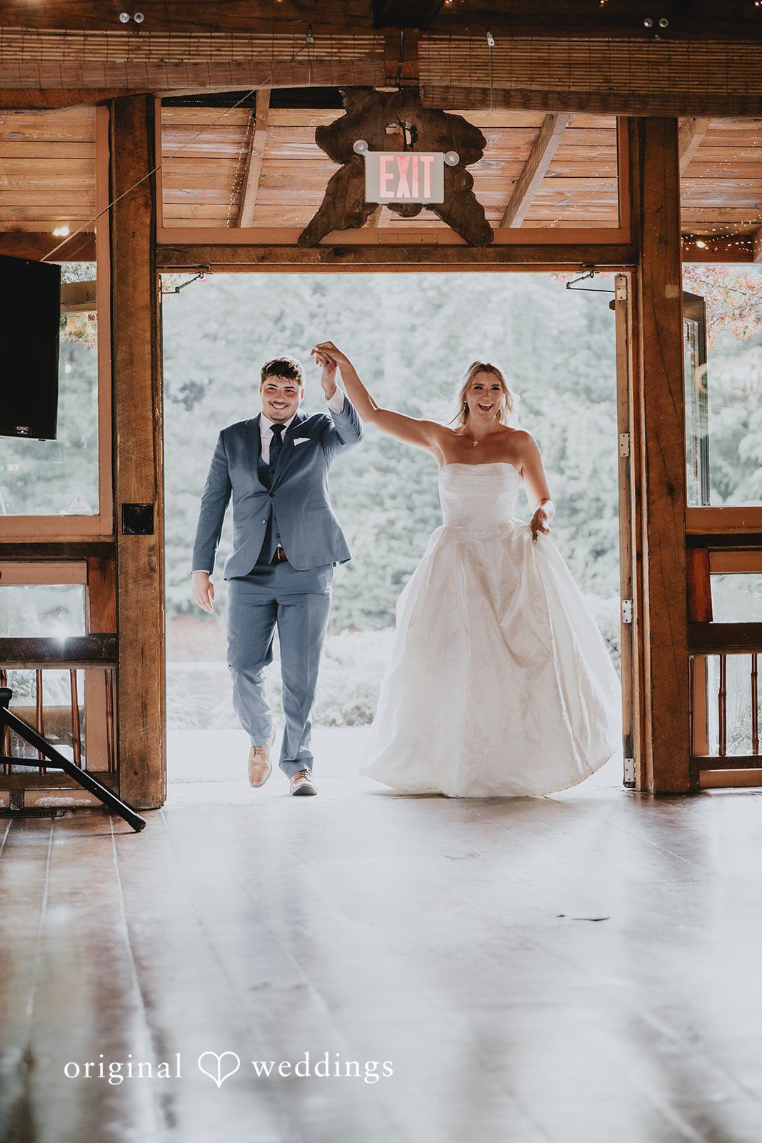 Julia + Kaleb Bride and groom entering the reception celebration