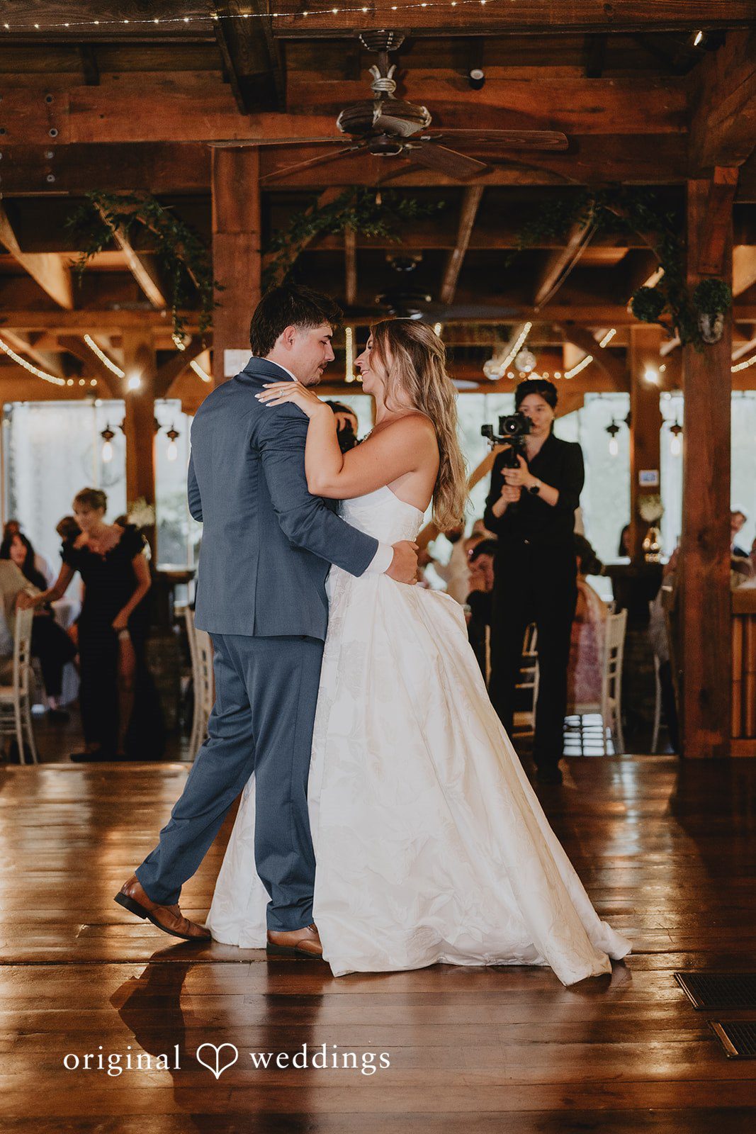 Julia + Kaleb Newlyweds sharing their first dance at the reception
