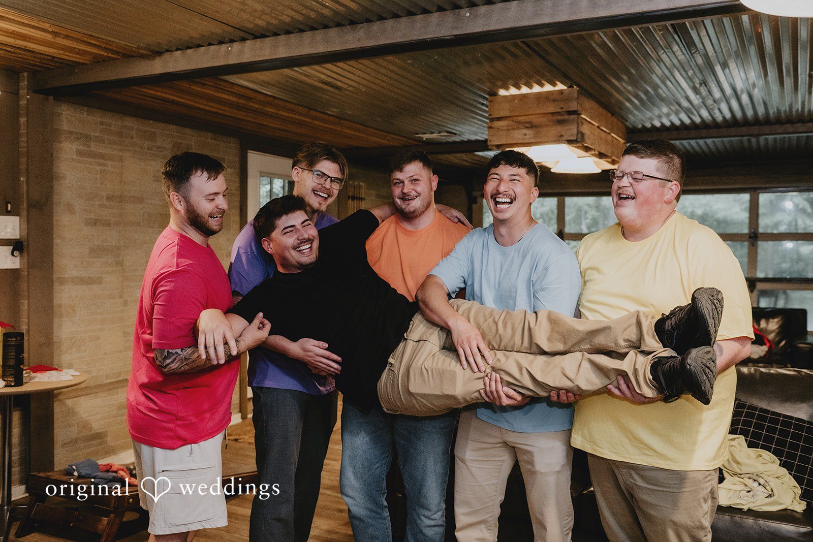 Julia + Kaleb Groom posing with groomsmen before the celebration