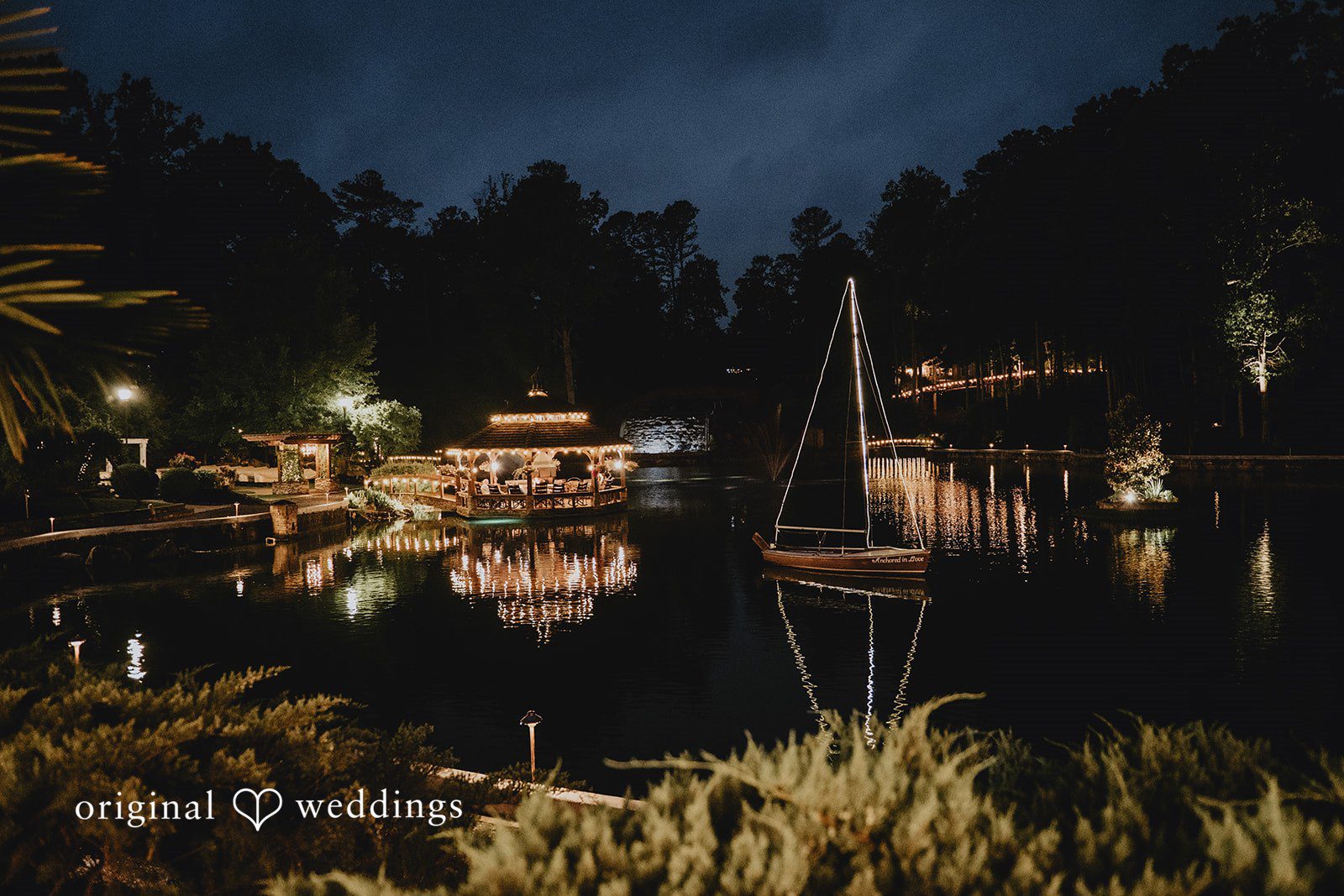 Julia + Kaleb Rocky's Lake Estate venue exterior at night
