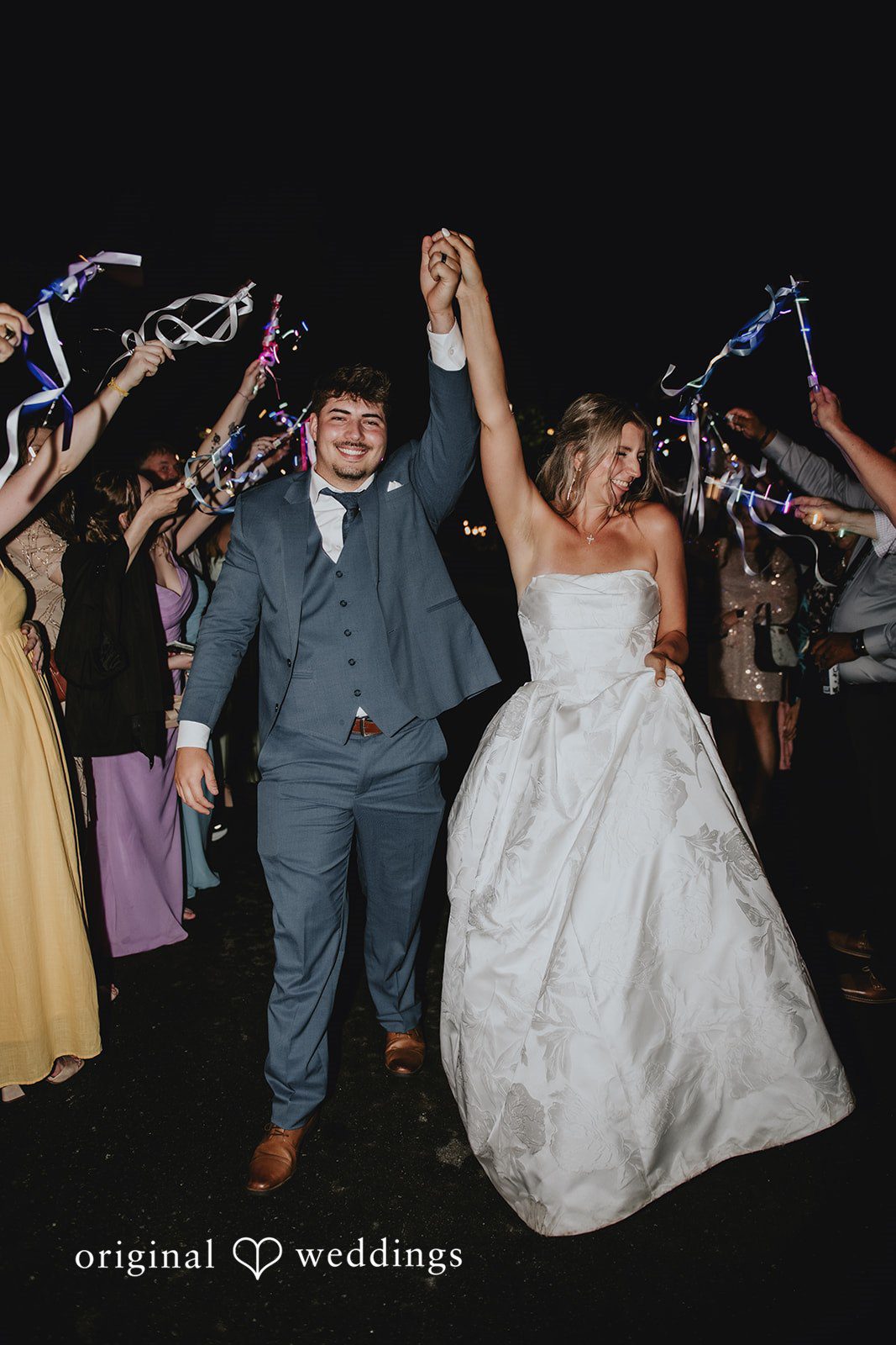 Julia + Kaleb Couple saying goodbye to guests at night