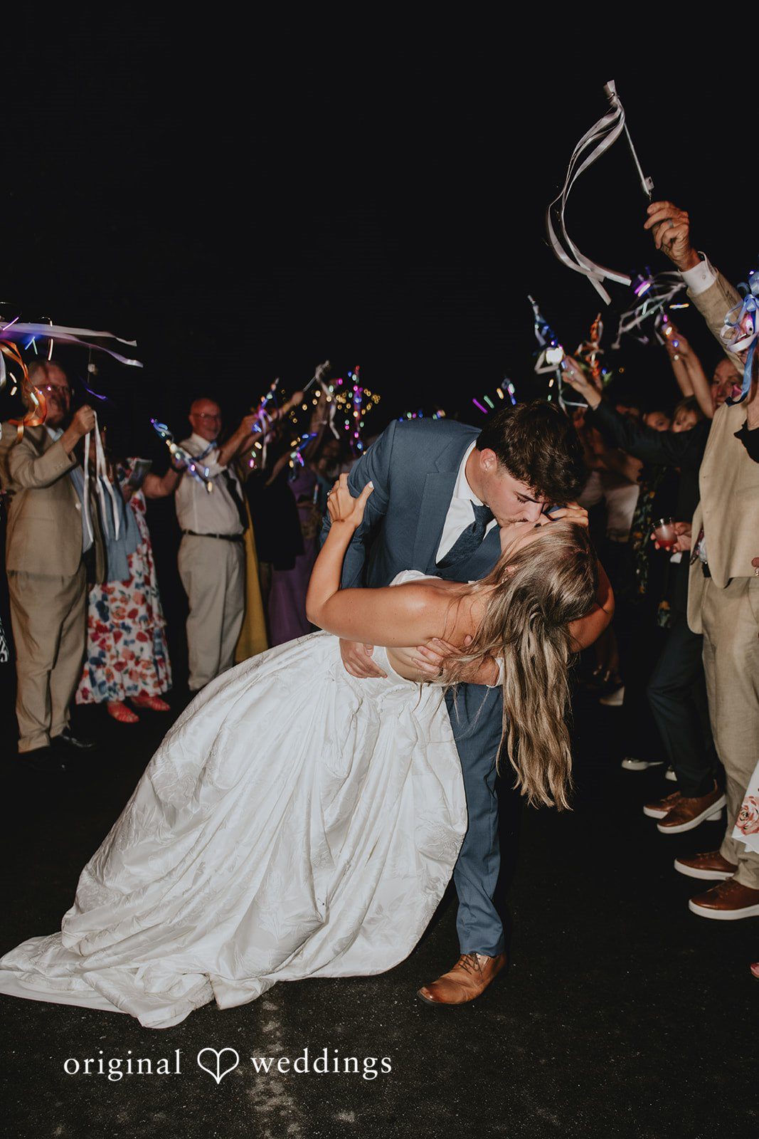 Julia + Kaleb Bride and groom sharing a final kiss at the end of the night