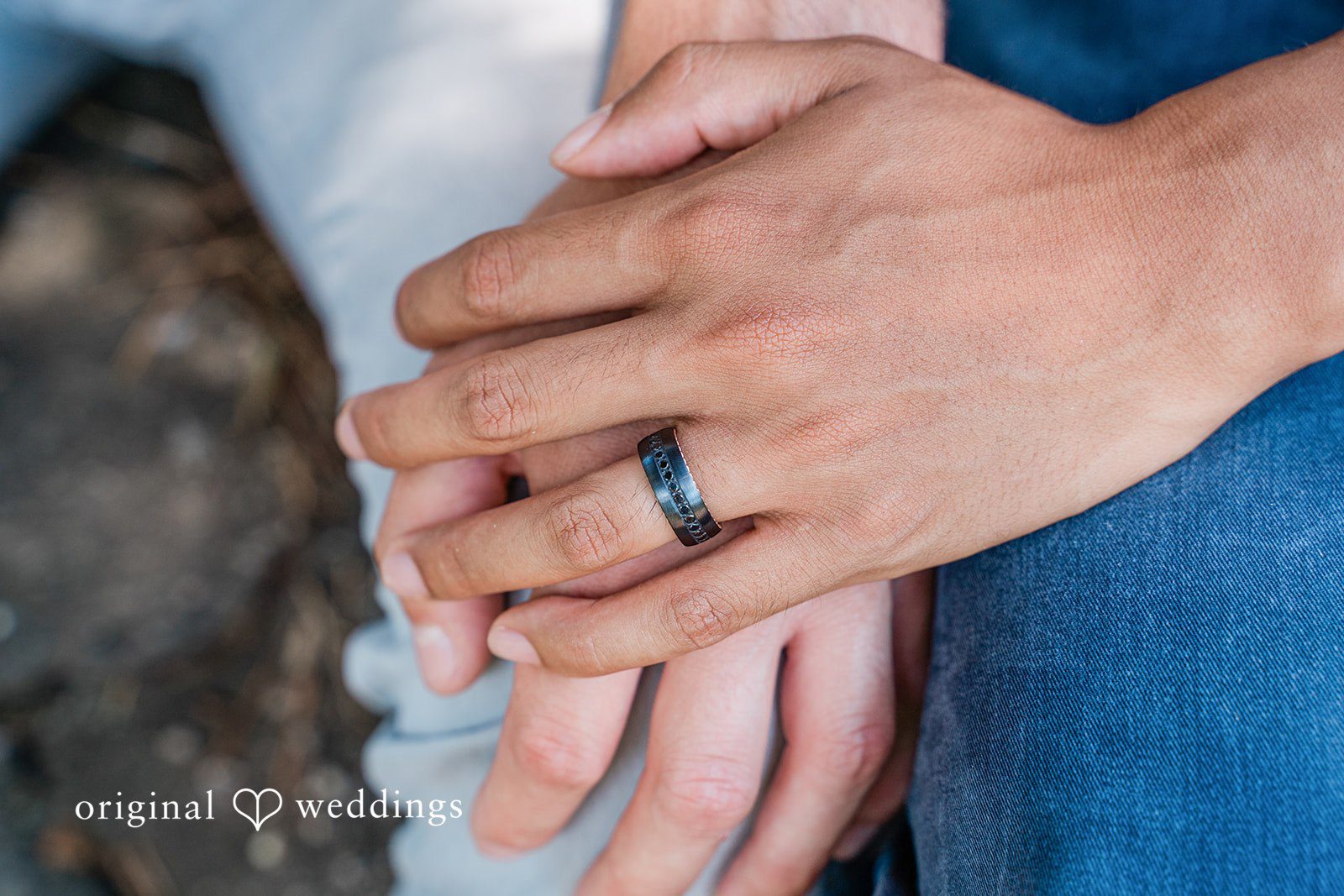 Romantic ring detail shot with couple holding hands at Roger Williams Park