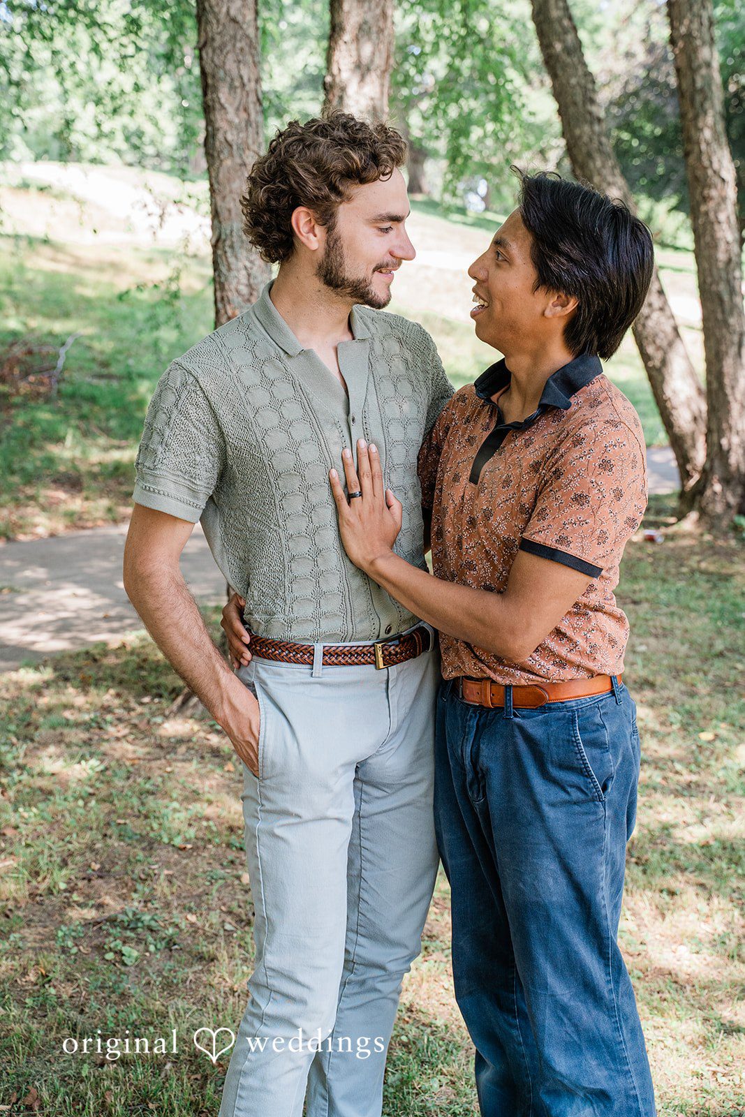 Couple embracing while looking at each other  near lake at Roger Williams Park