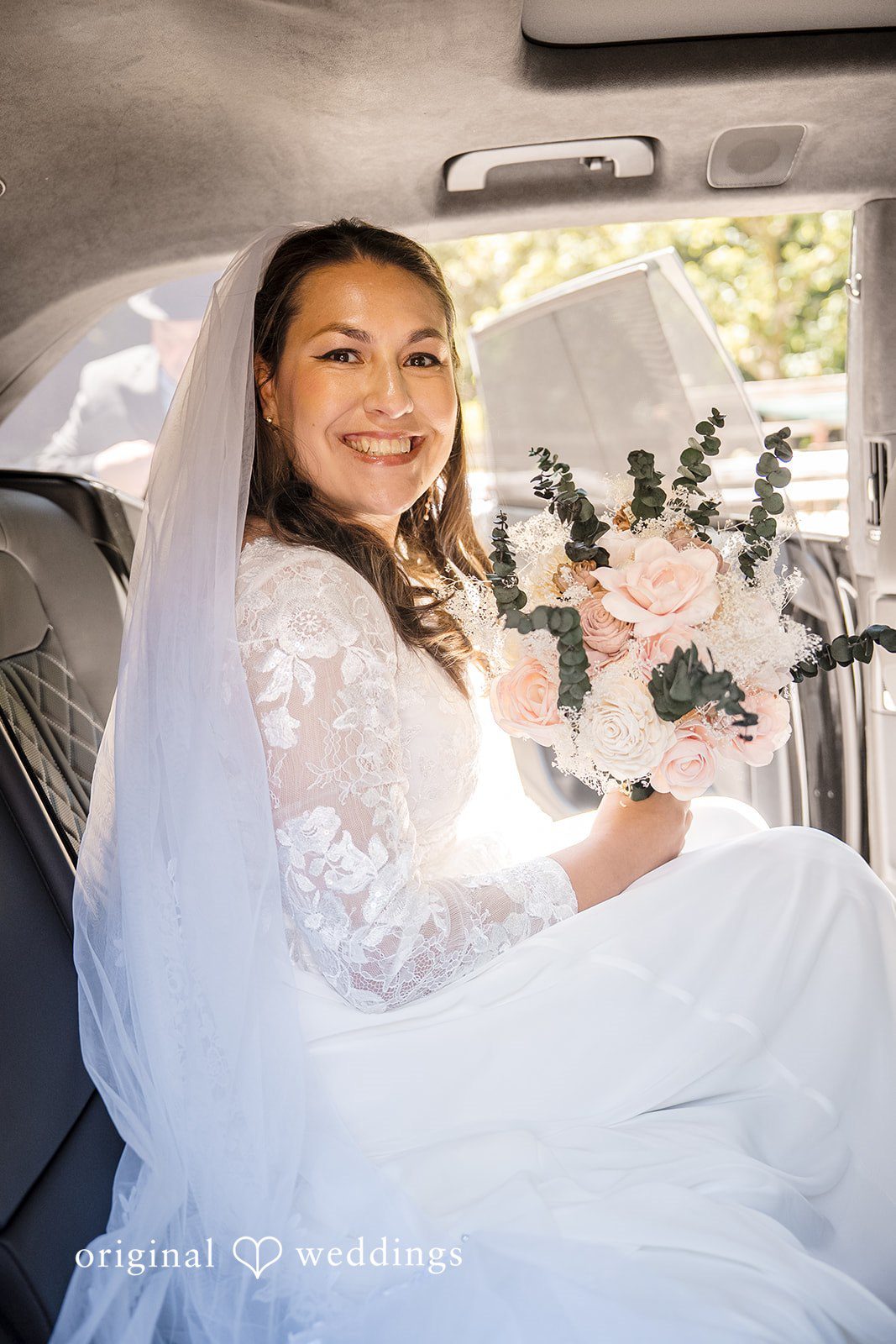 Brittany + Shane Bride smiling while sitting inside the car at Sanborn County Park