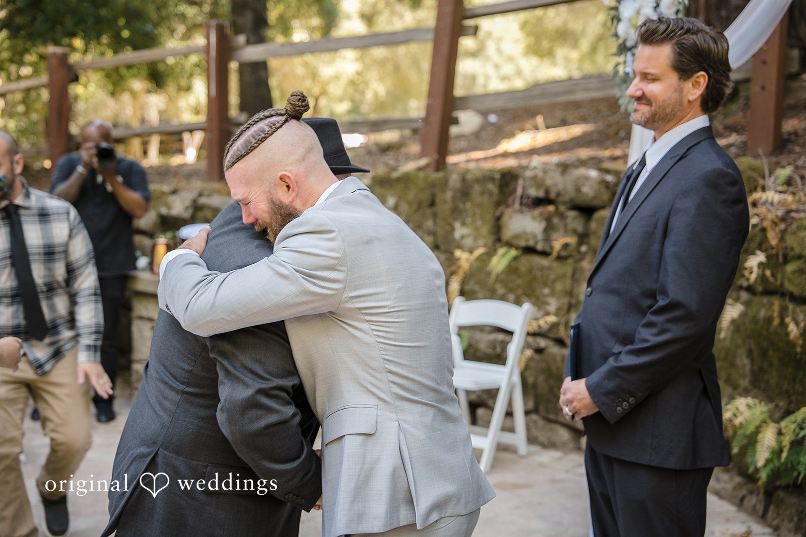 Brittany + Shane Groom emotionally hugging someone at Sanborn County Park
