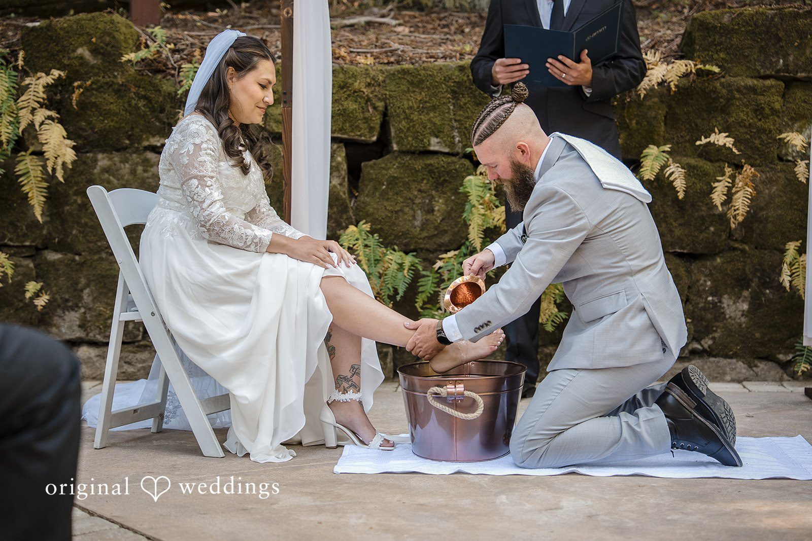 Brittany + Shane Emotional foot washing ceremony of the bride and groom at Sanborn County Park