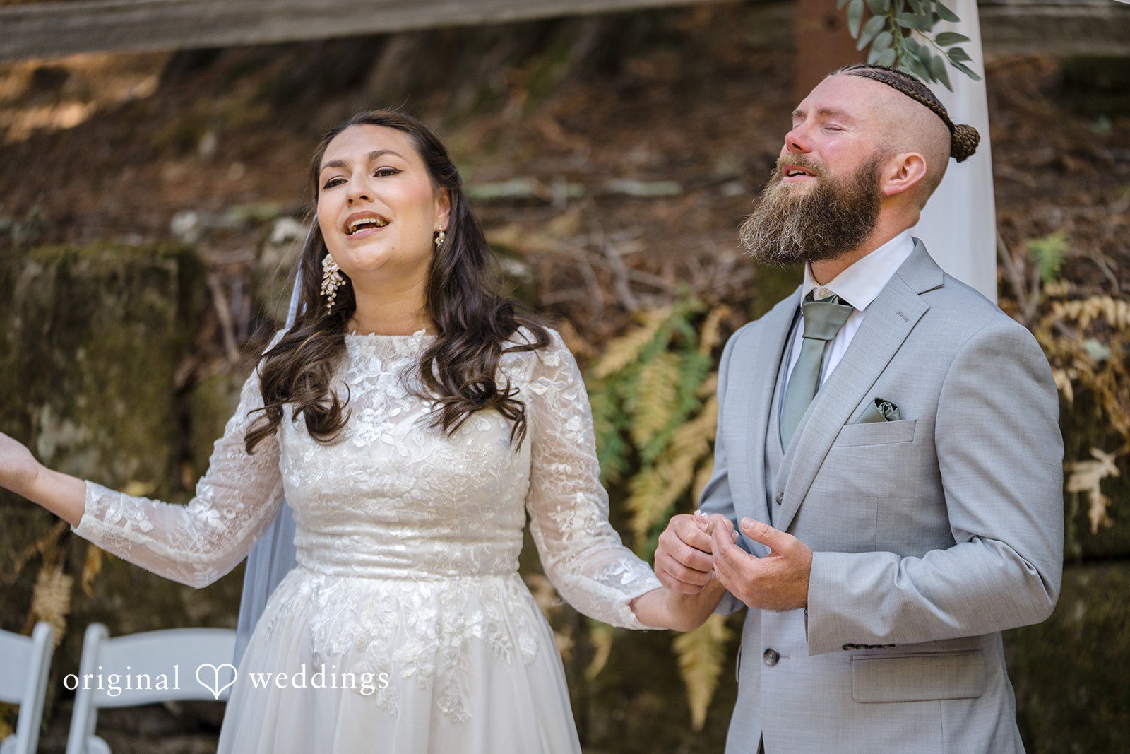 Brittany + Shane Couple standing together with a thankful gesture at Sanborn County Park