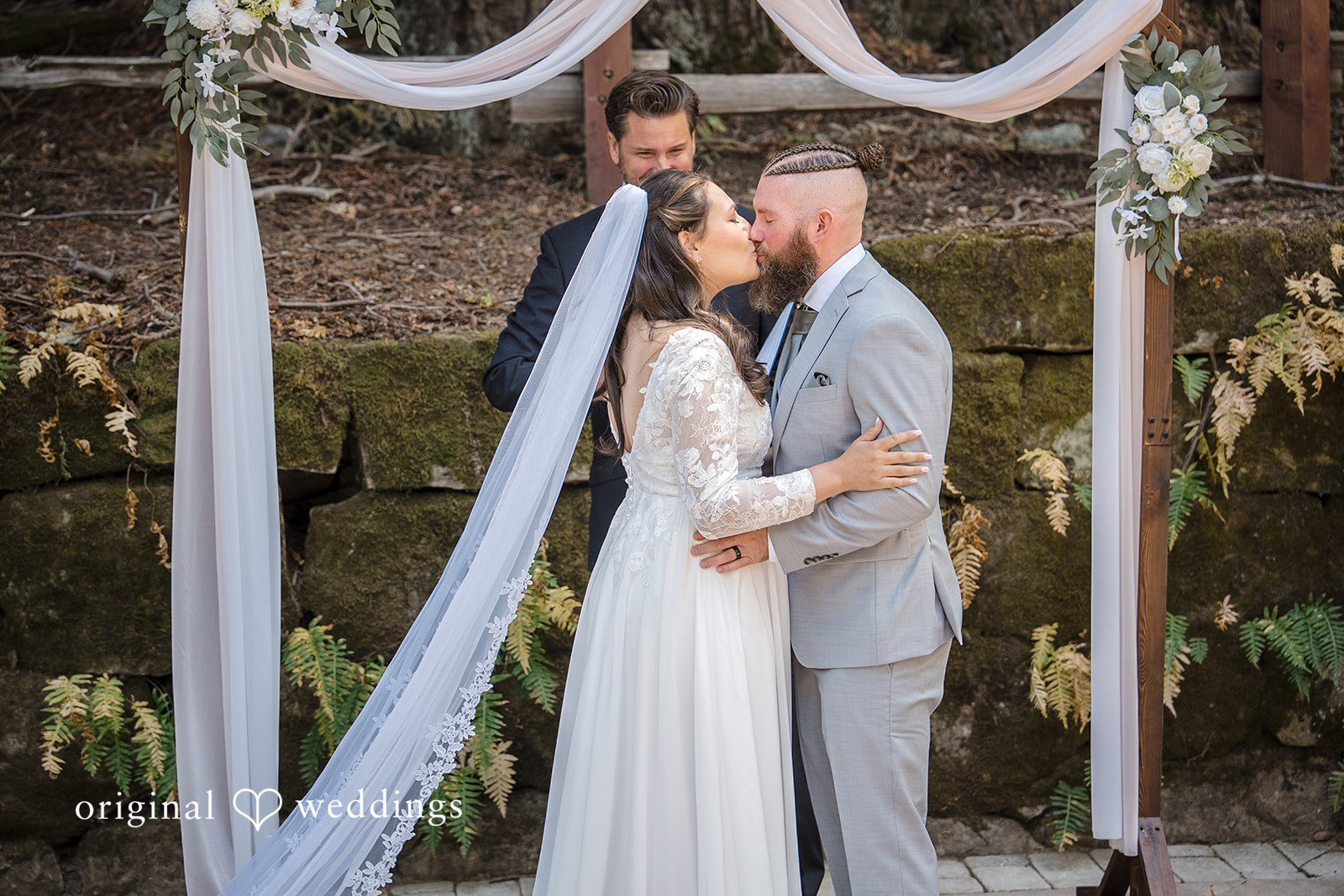 Brittany + Shane Couple sharing a romantic kiss at Sanborn County Park