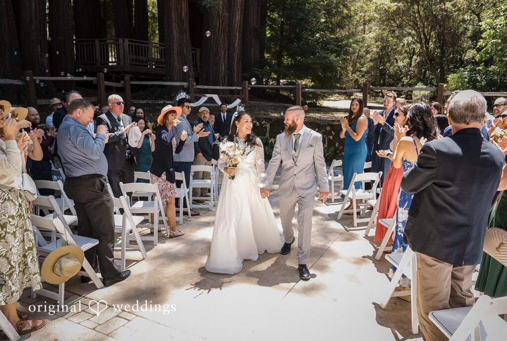 Brittany + Shane San Francisco Wedding Photographers capturing couple walking outside after the ceremony at Sanborn County Park by Original Weddings