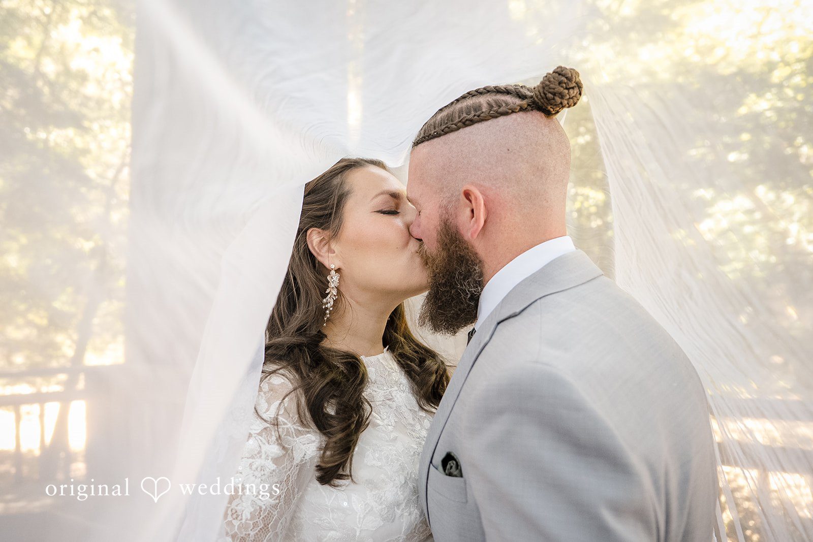 Brittany + Shane Bride and groom kissing during their photography session at Sanborn County Park