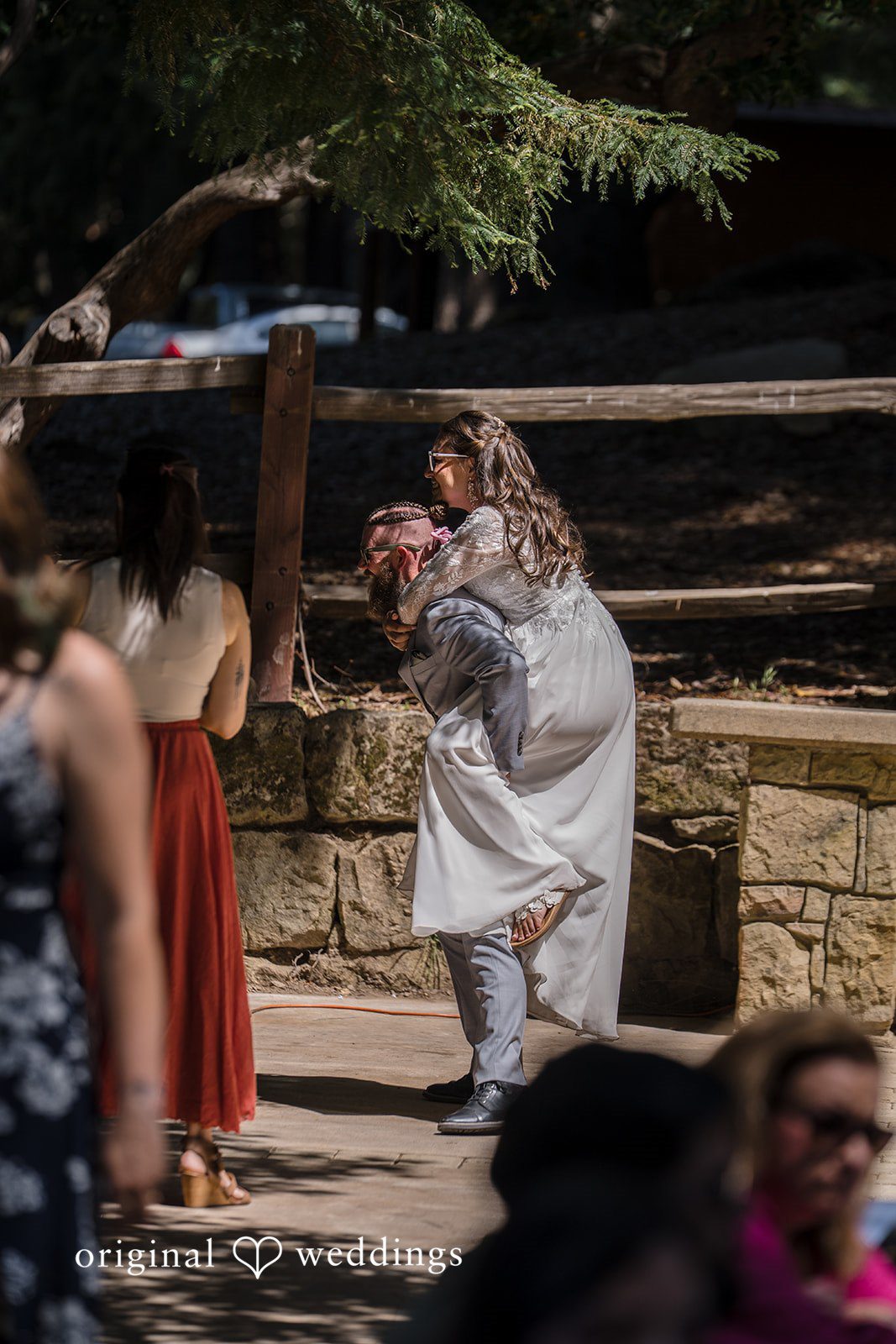 Brittany + Shane Romantic portrait of the groom carrying the bride at Sanborn County Park