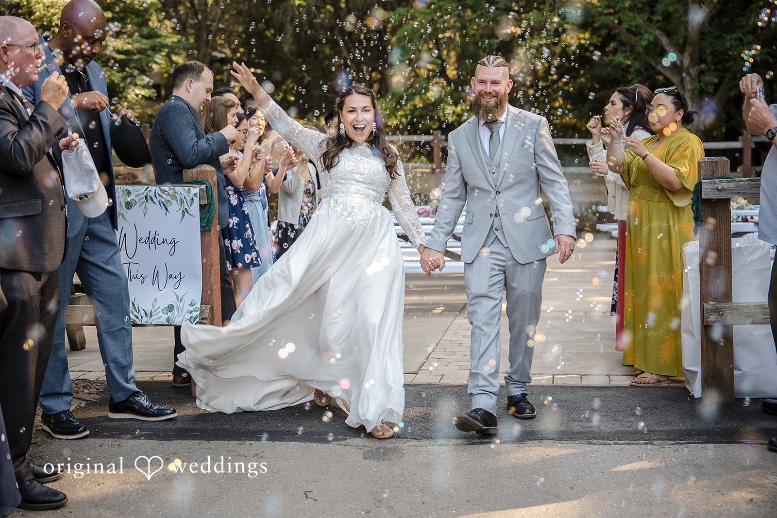 Brittany + Shane San Francisco Wedding Photographers capturing couple walking outside after the wedding at Sanborn County Park by Original Weddings