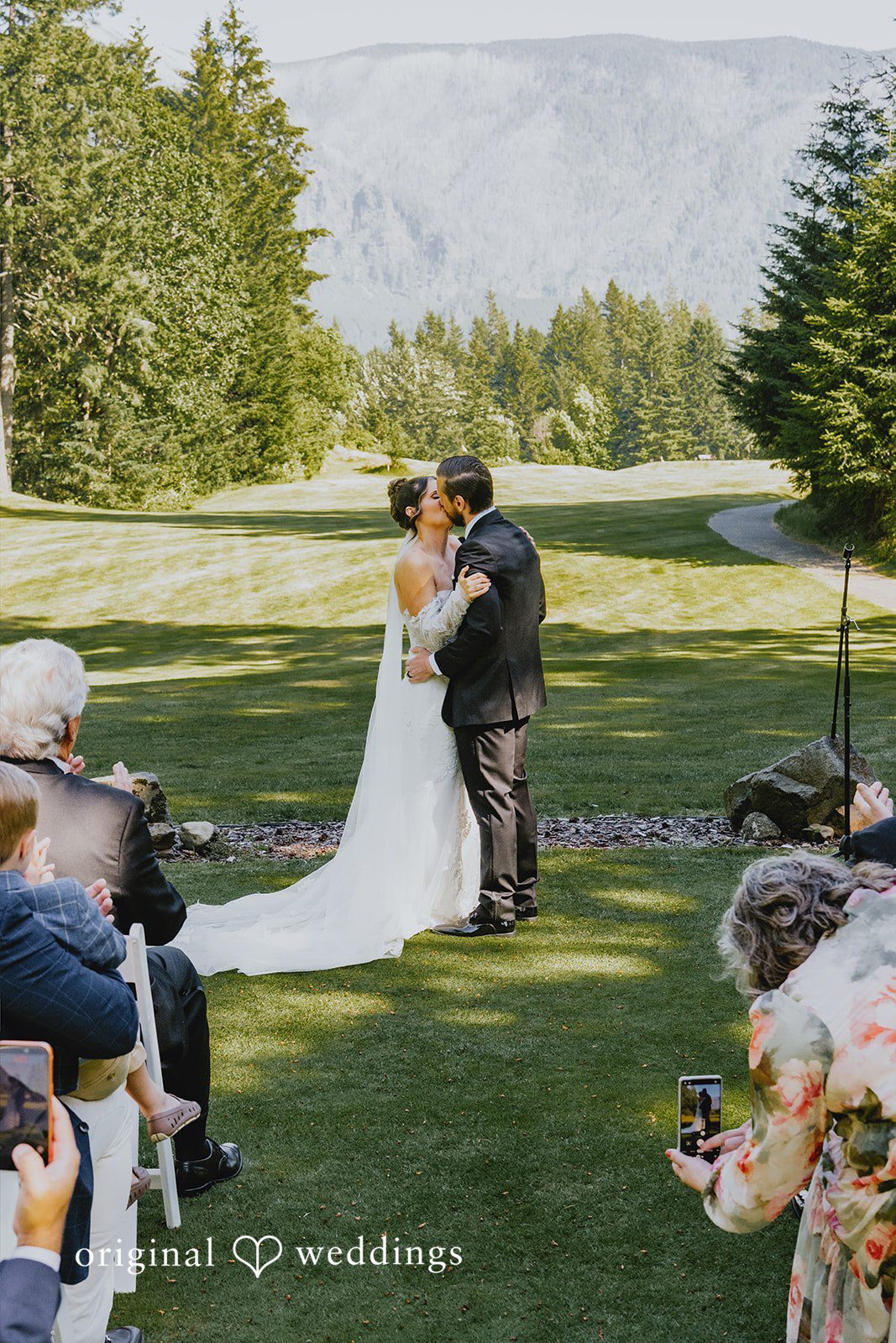 Kristina + Christopher Bride and groom kissing at the altar after wedding ceremony.