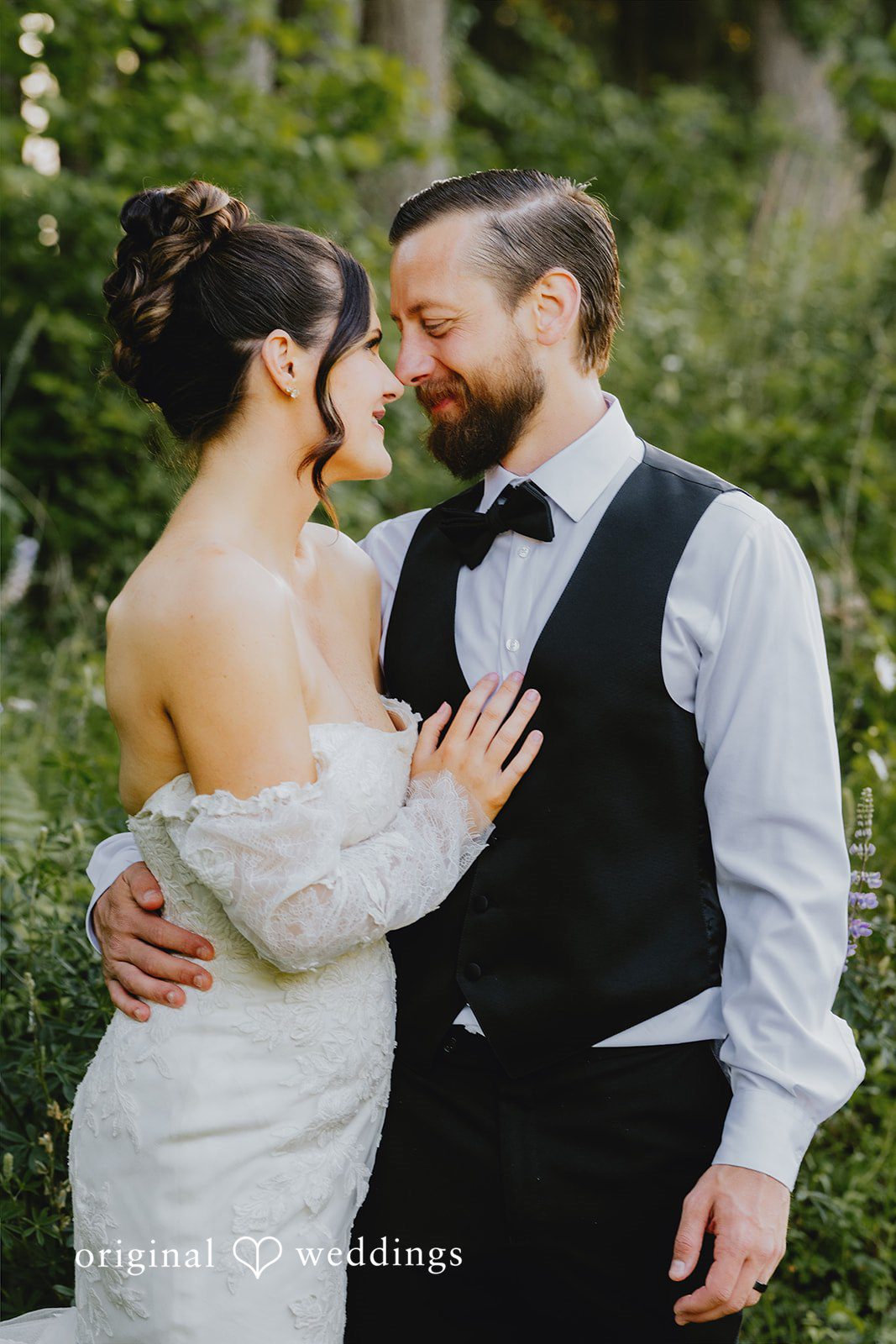 Kristina + Christopher Bride and groom smiling warmly at each other in an embrace.