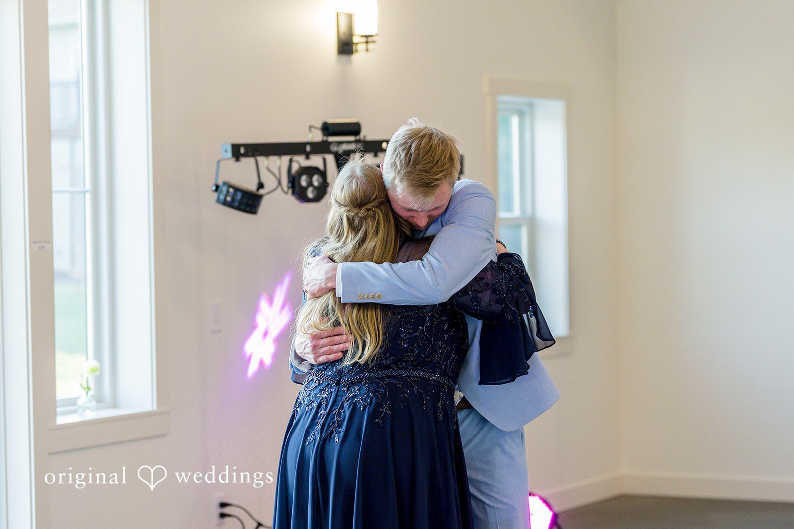 Emily + Ridge Emotional reception hug at Spruce Hill