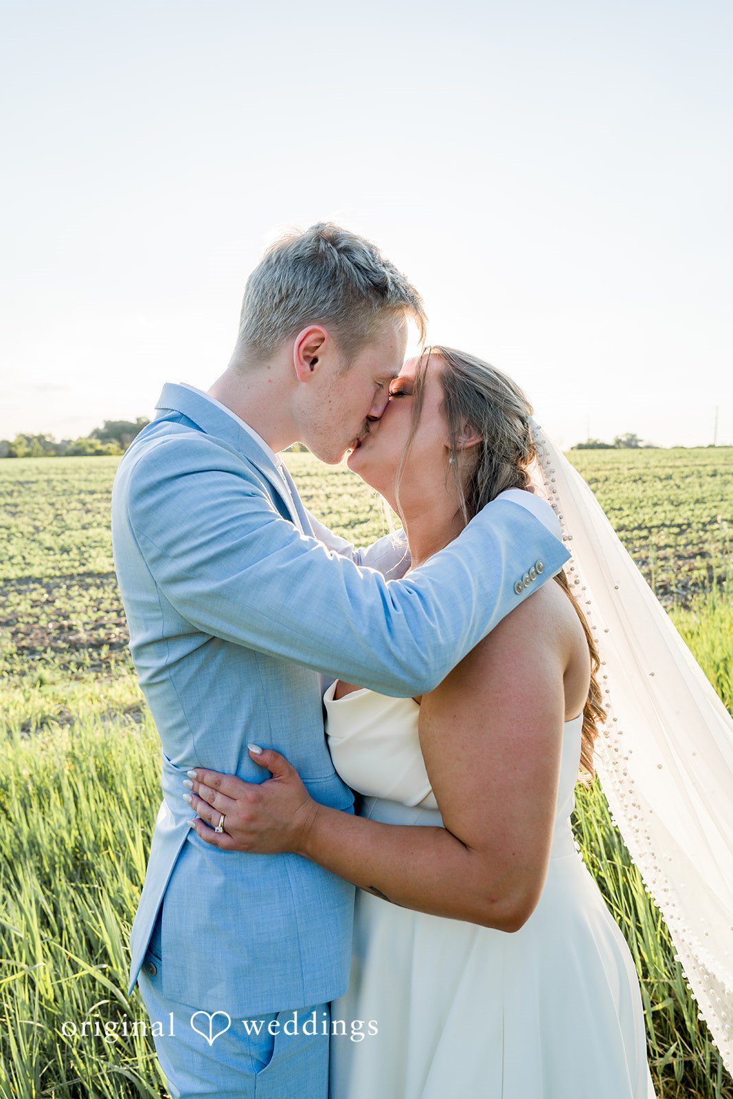 Emily + Ridge Outdoor wedding photography capturing an intimate moment.