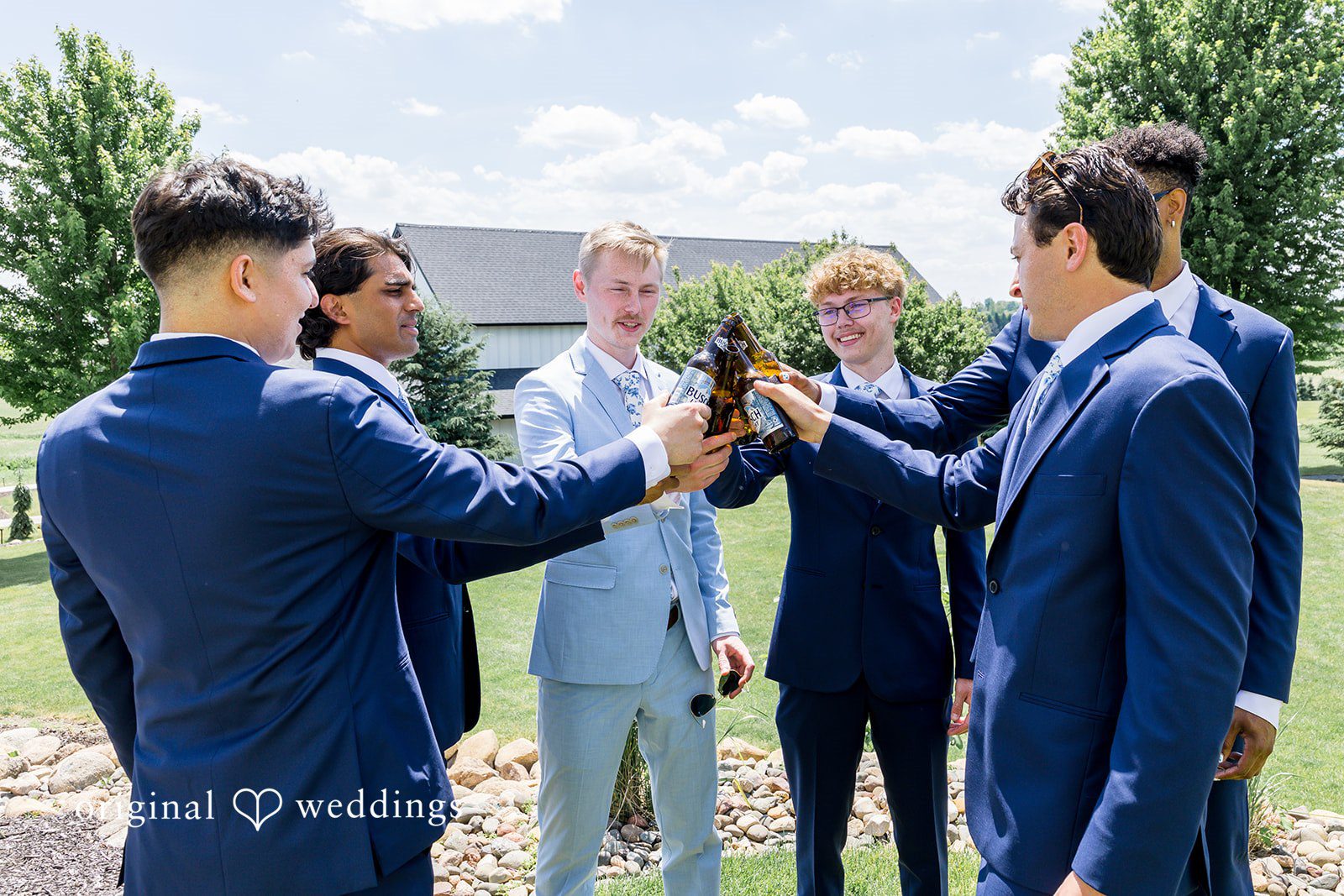 Emily + Ridge Groom celebrating with his groomsmen at Spruce Hill