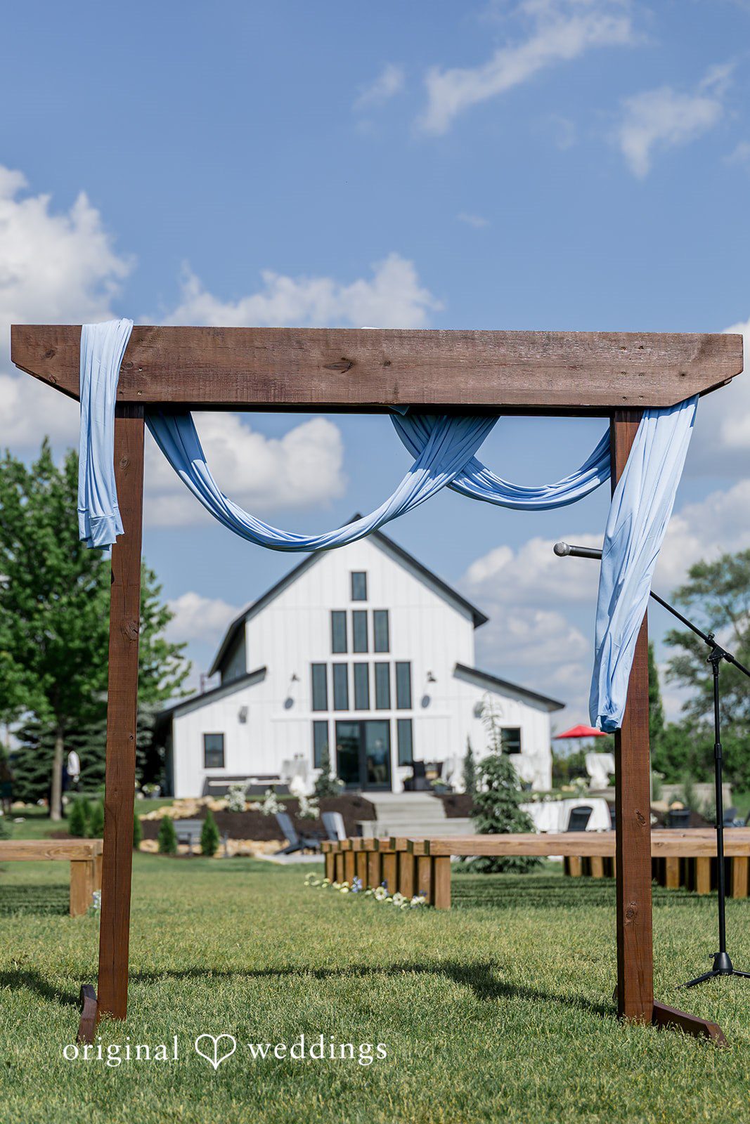 Emily + Ridge Outdoor ceremony arch at Spruce Hill captured by Minneapolis Wedding Photographers from Original Weddings