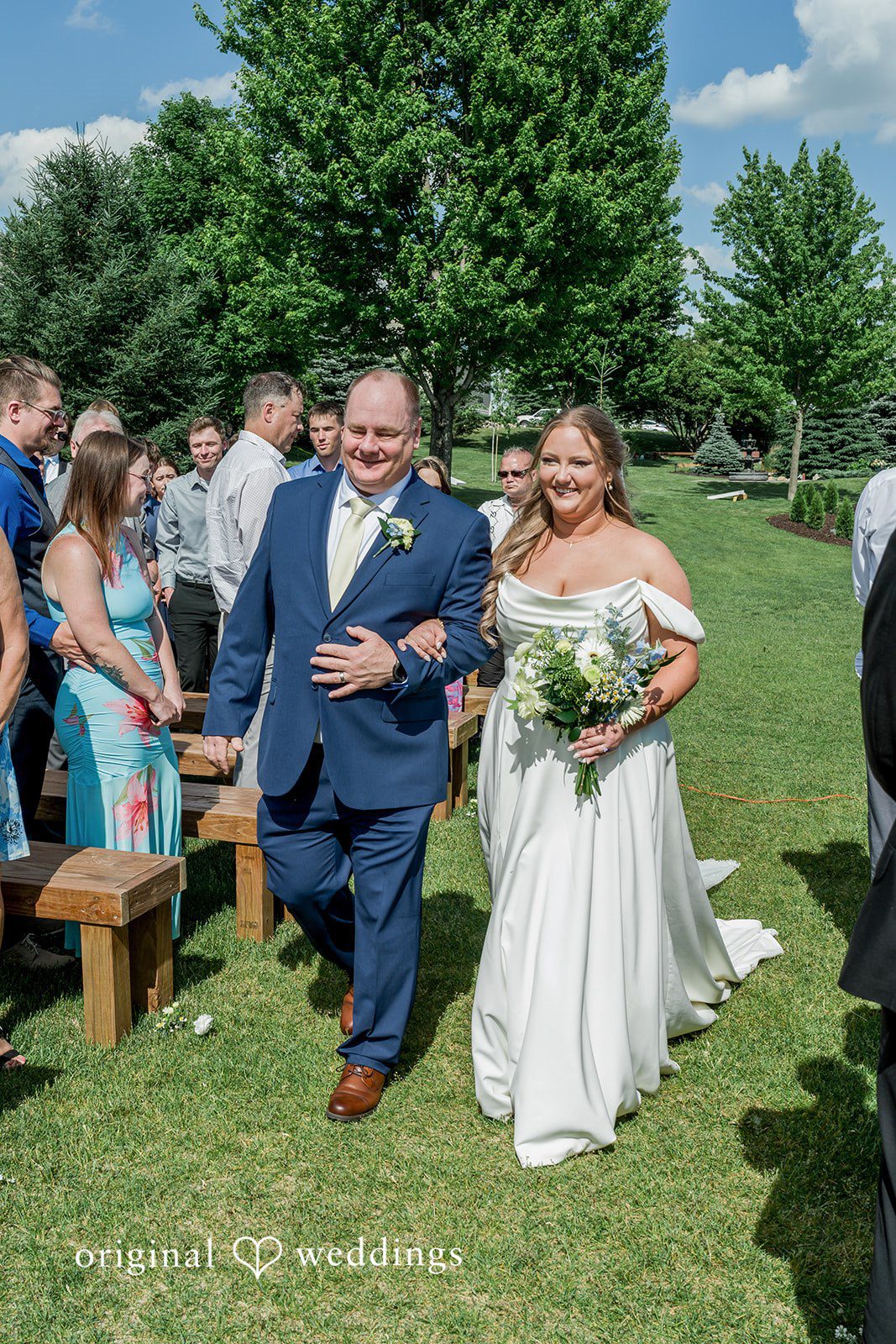 Emily + Ridge Bride walking down the aisle at Spruce Hill