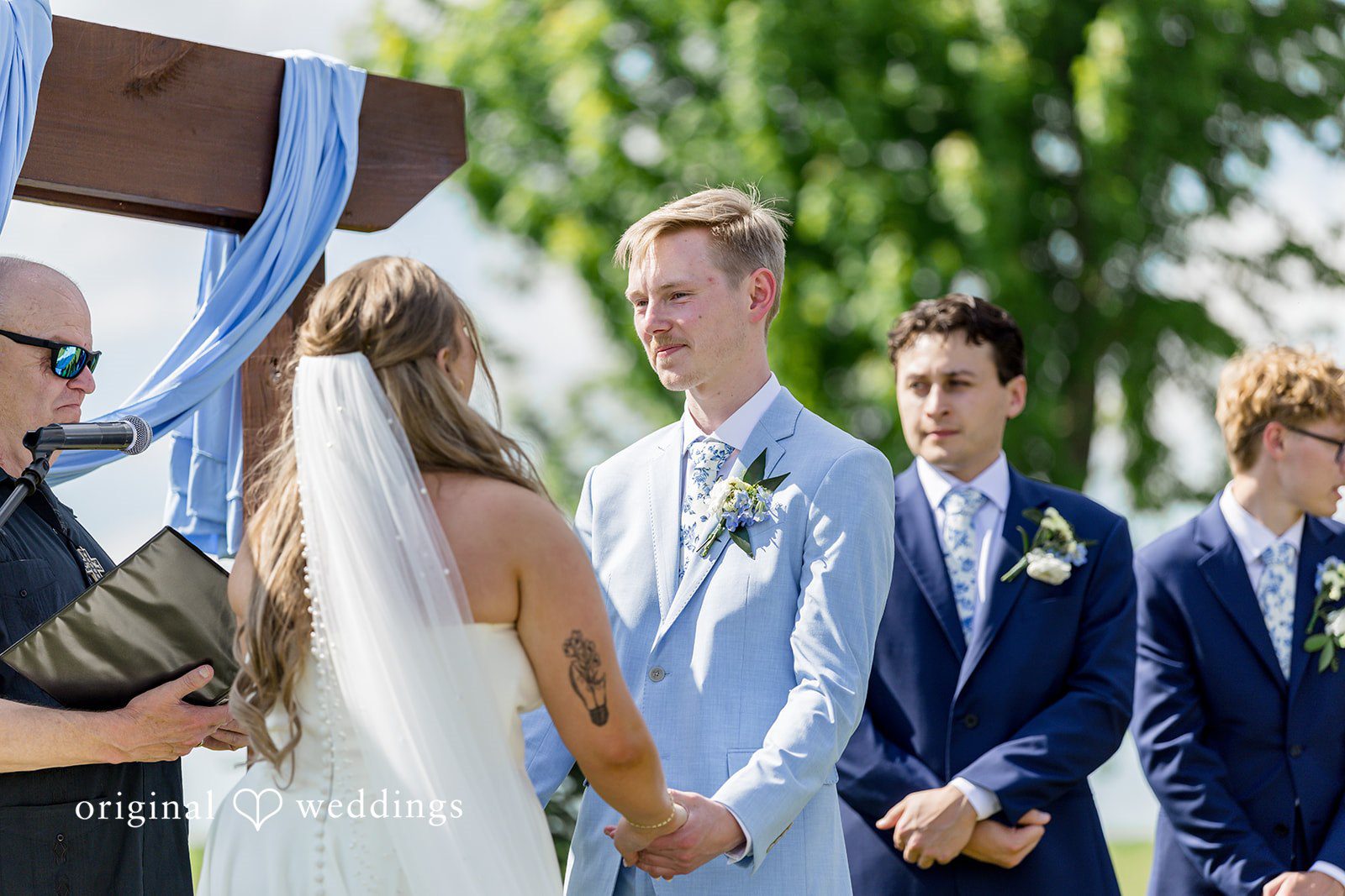 Emily + Ridge Groom holding the bride hands during an emotional ceremony
