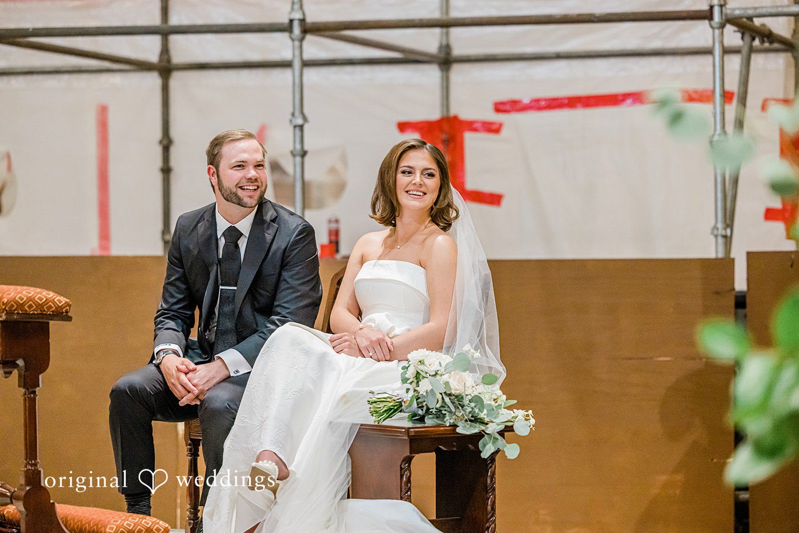 Luke + Madison Bride and groom smiling during the ceremony at St. Clair Ballroom.