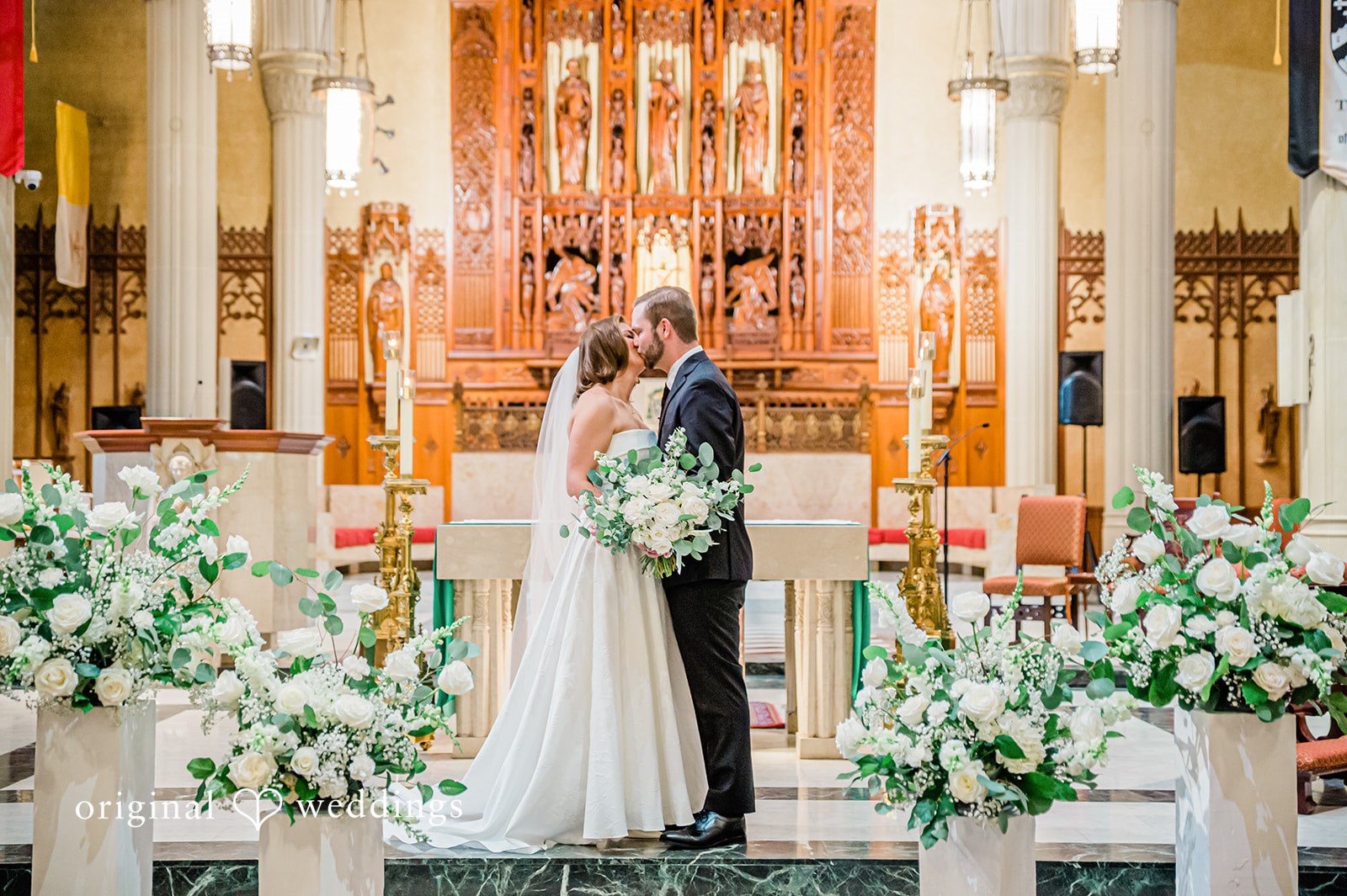 Luke + Madison Couple sharing a romantic kiss at St. Clair Ballroom captured by Cleveland Wedding Photographers from Original Weddings.