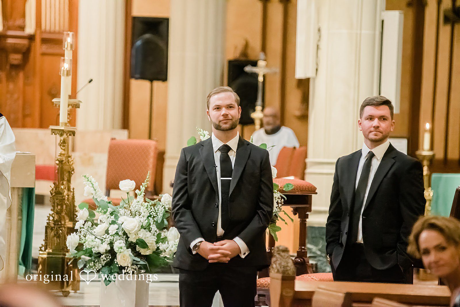 Luke + Madison Groom waiting at the ceremony altar at St. Clair Ballroom