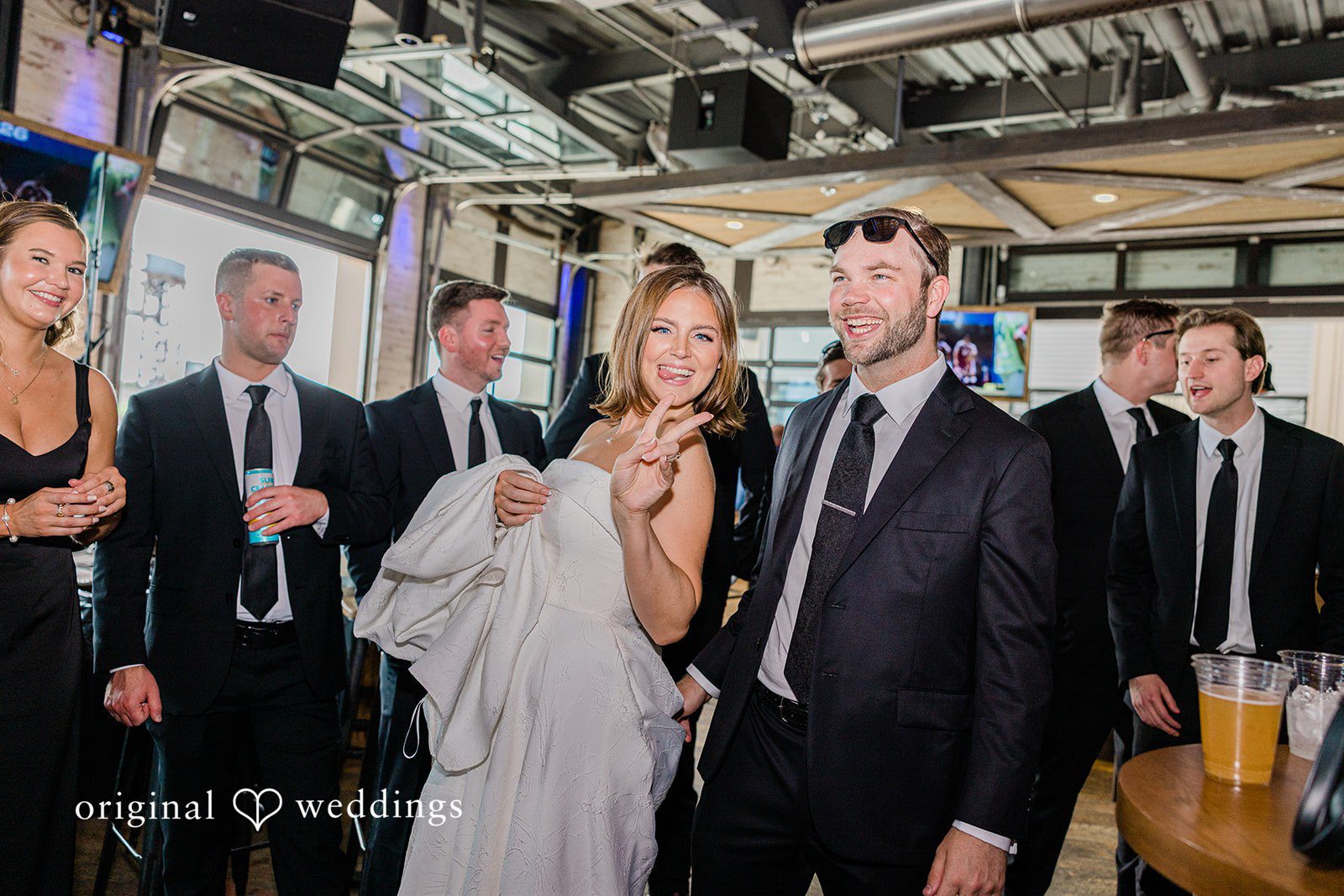 Luke + Madison Bride and groom enjoying the reception at St. Clair Ballroom captured by Cleveland Wedding Photographers from Original Weddings.