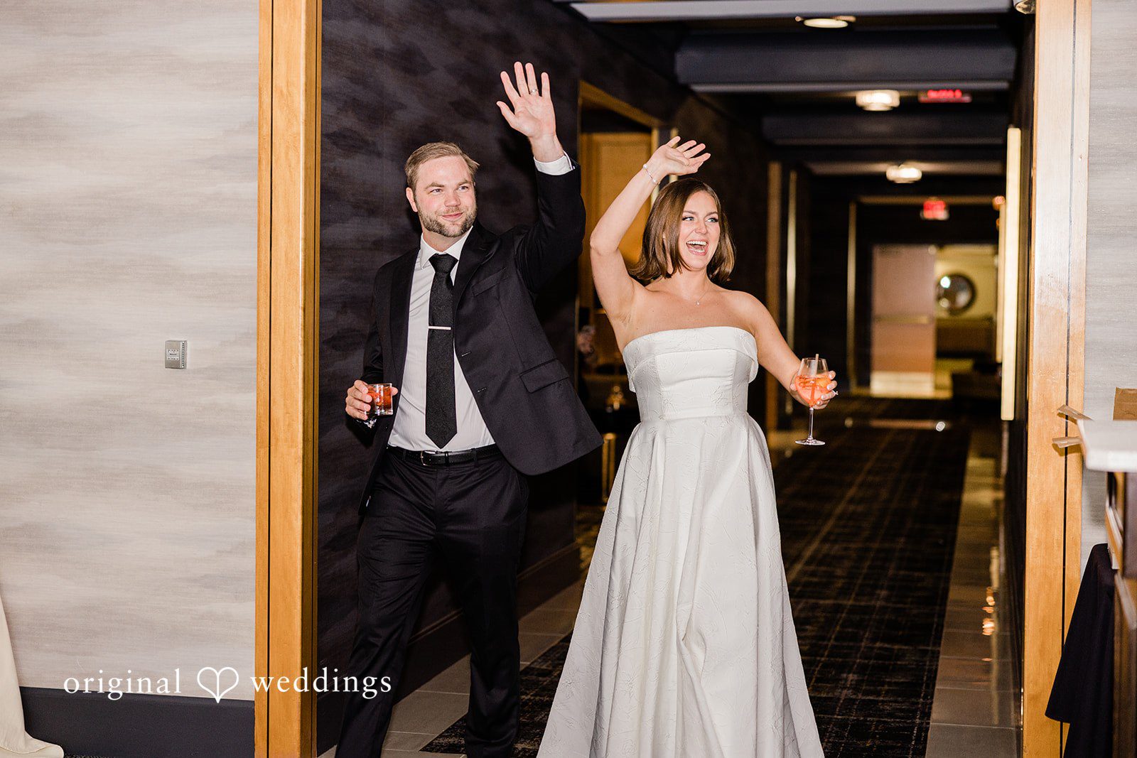 Luke + Madison Bride and groom making their reception entrance at St. Clair Ballroom