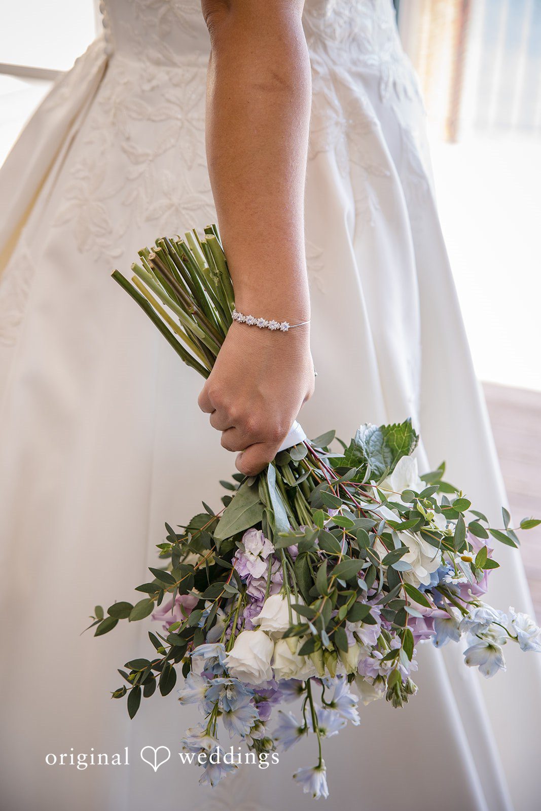 James + Nora Bride holding a beautiful wedding bouquet at St. Clair Inn