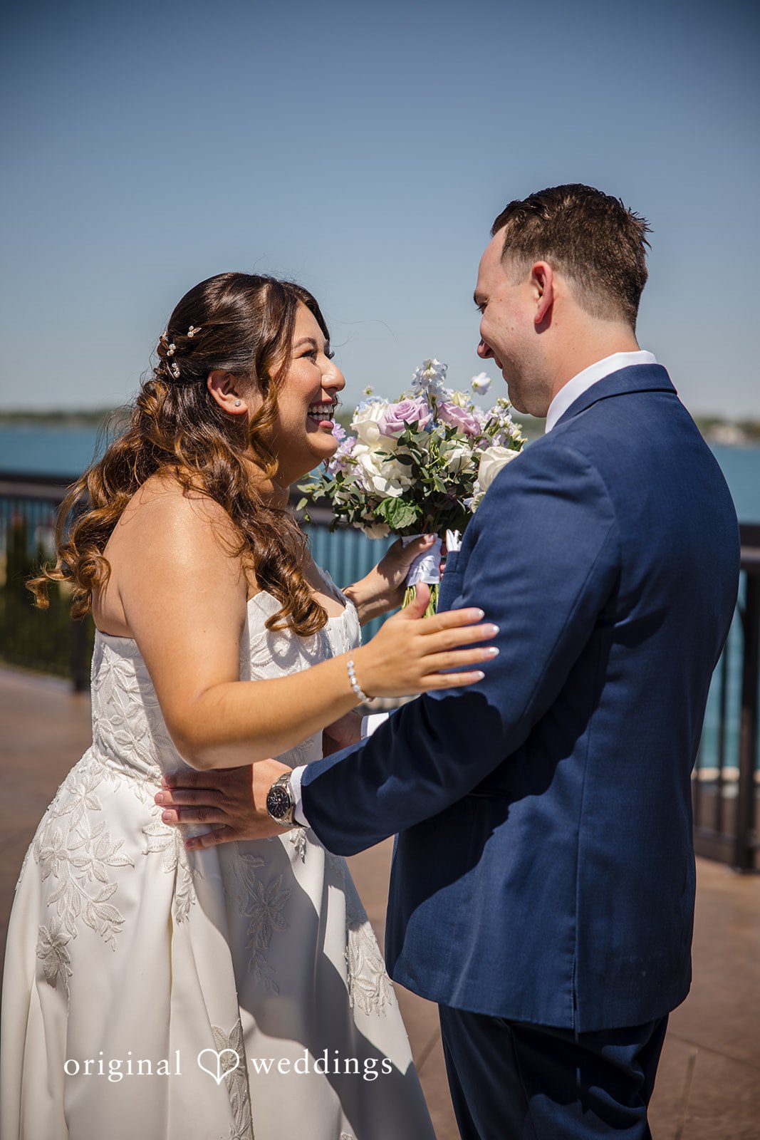 James + Nora Bride and groom sharing a joyful moment at St. Clair Inn