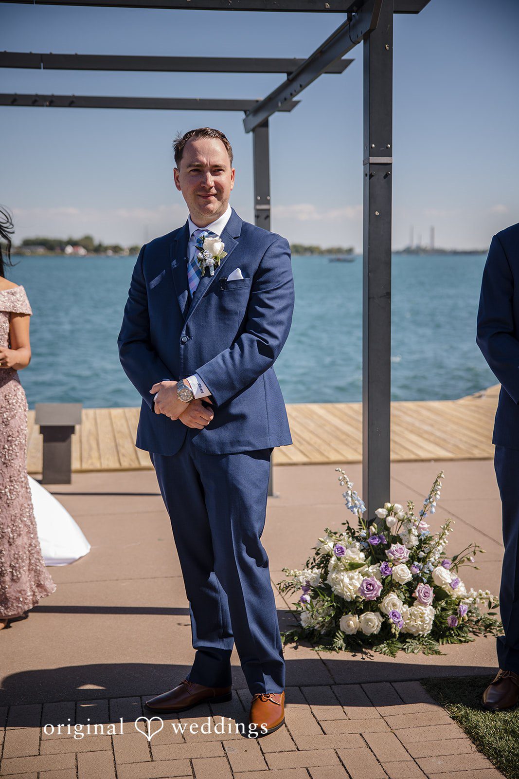 James + Nora Groom smiling as the bride enters at St. Clair Inn