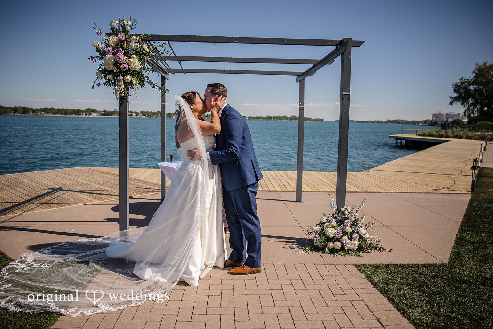 James + Nora Bride and groom sharing their first kiss at St. Clair Inn