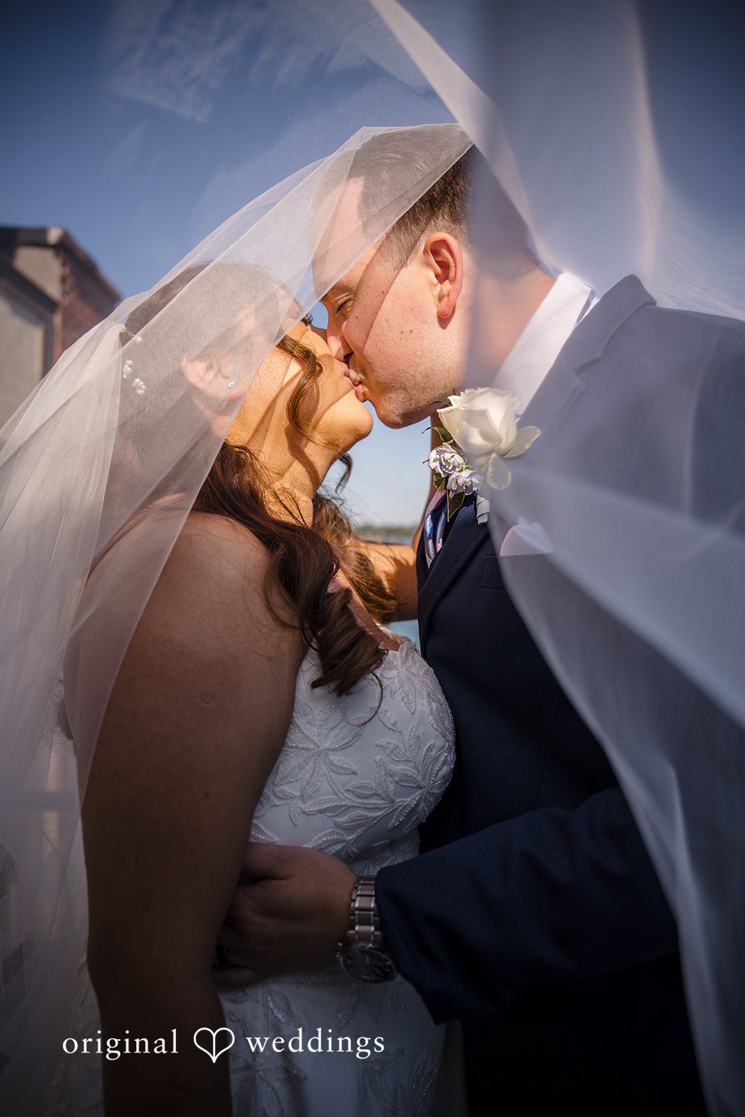 James + Nora Bride and groom sharing a lovely kiss at St. Clair Inn